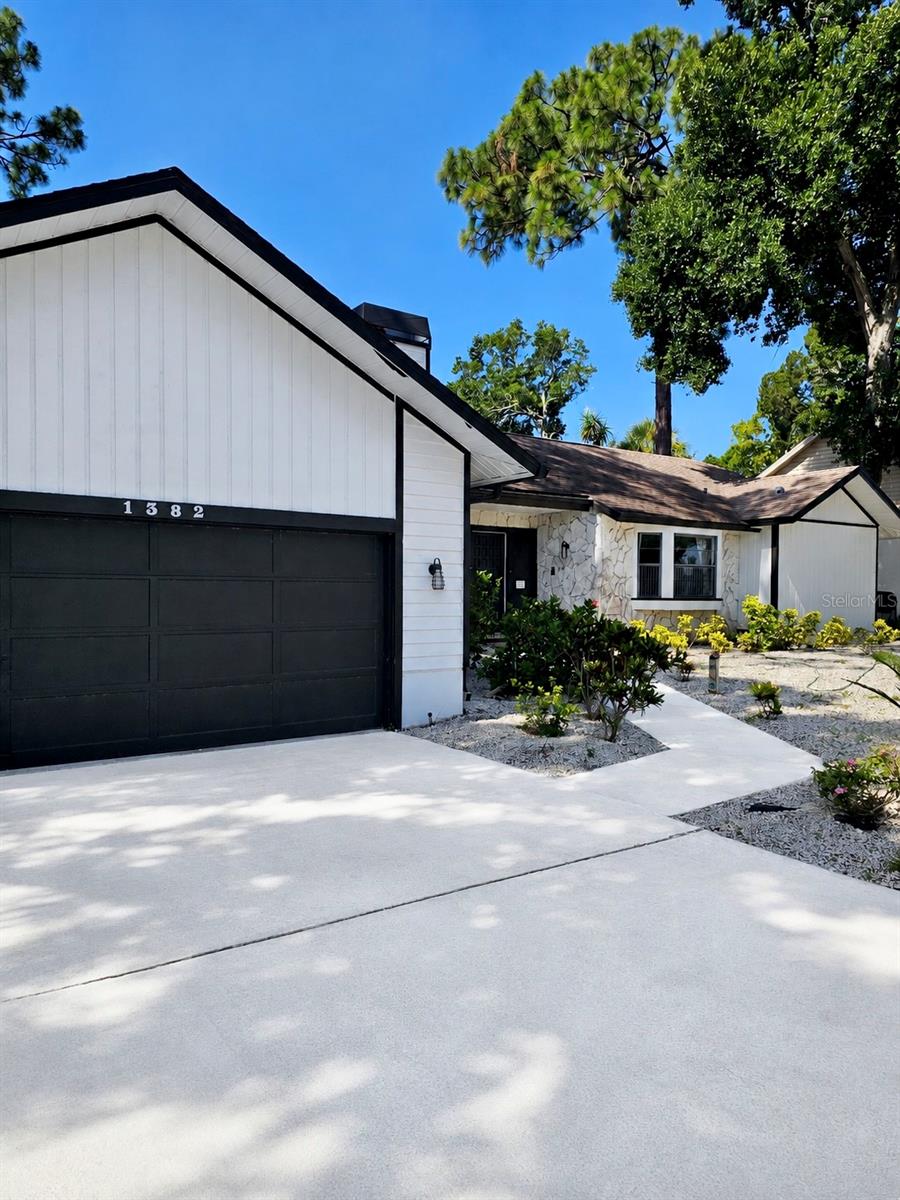 NO HOA! Rarely available, this well-maintained 3-bedroom, 2-bath pool home is located in one of Palm Harbor's most desirable neighborhoods and within the highly sought-after Palm Harbor University High School district.Tucked away in a quiet community with a single entrance and no through traffic, this home sits on elevated ground and offers a rare combination of privacy, convenience, and location. Enjoy walking or biking to Palm Harbor University High School, historic downtown Palm Harbor, the Pinellas Trail, local restaurants, shops, parks, and top-rated schools, while remaining just minutes from Honeymoon Island and the Gulf beaches.The previous owner completed several major improvements in 2020, including a new roof and chimney with transferable warranty, pool resurfacing, new wood fencing, significant tree removal and trimming, and irrigation system updates utilizing reclaimed water.Since purchasing the home in 2020, the current owner has invested approximately $100,000 in renovations, maintenance, and improvements throughout the property. The exterior has been repainted, the home has been meticulously maintained, and the HVAC system has been professionally serviced, with approximately $1,500 recently invested to ensure continued performance and reliability.Inside, the split-bedroom floor plan offers both functionality and comfort. The spacious primary suite features a bonus sitting room, office, or flex space, dual closets including a walk-in closet, and a large walk-in shower. The family room boasts vaulted ceilings and a beautiful stone wood-burning fireplace, creating a warm and inviting gathering space. The kitchen is designed for entertaining with a convenient pass-through window to the screened lanai and pool area.The front yard showcases a custom Costa Rica-inspired tropical rockscape designed for low maintenance and water conservation while complementing Florida's natural beauty. The backyard has been cleared and opened up, providing a blank canvas for the next owner to create their own outdoor vision and make the space their own.Adding to the value, the home is priced in line with a recent appraisal and is being offered fully furnished, including televisions, washer and dryer, lawn equipment, and most furnishings, providing a rare turnkey opportunity without the additional expense and hassle of furnishing a home. Whether you're relocating, purchasing a second home, or simply looking for a seamless move, much of what you need is already here.This hidden gem combines location, lifestyle, major capital improvements, and exceptional value in one of Palm Harbor's most sought-after areas. Homes with no HOA, a private pool, top-rated schools, and walkable access to downtown Palm Harbor rarely become available. Property is being sold as-is for the convenience of the seller.