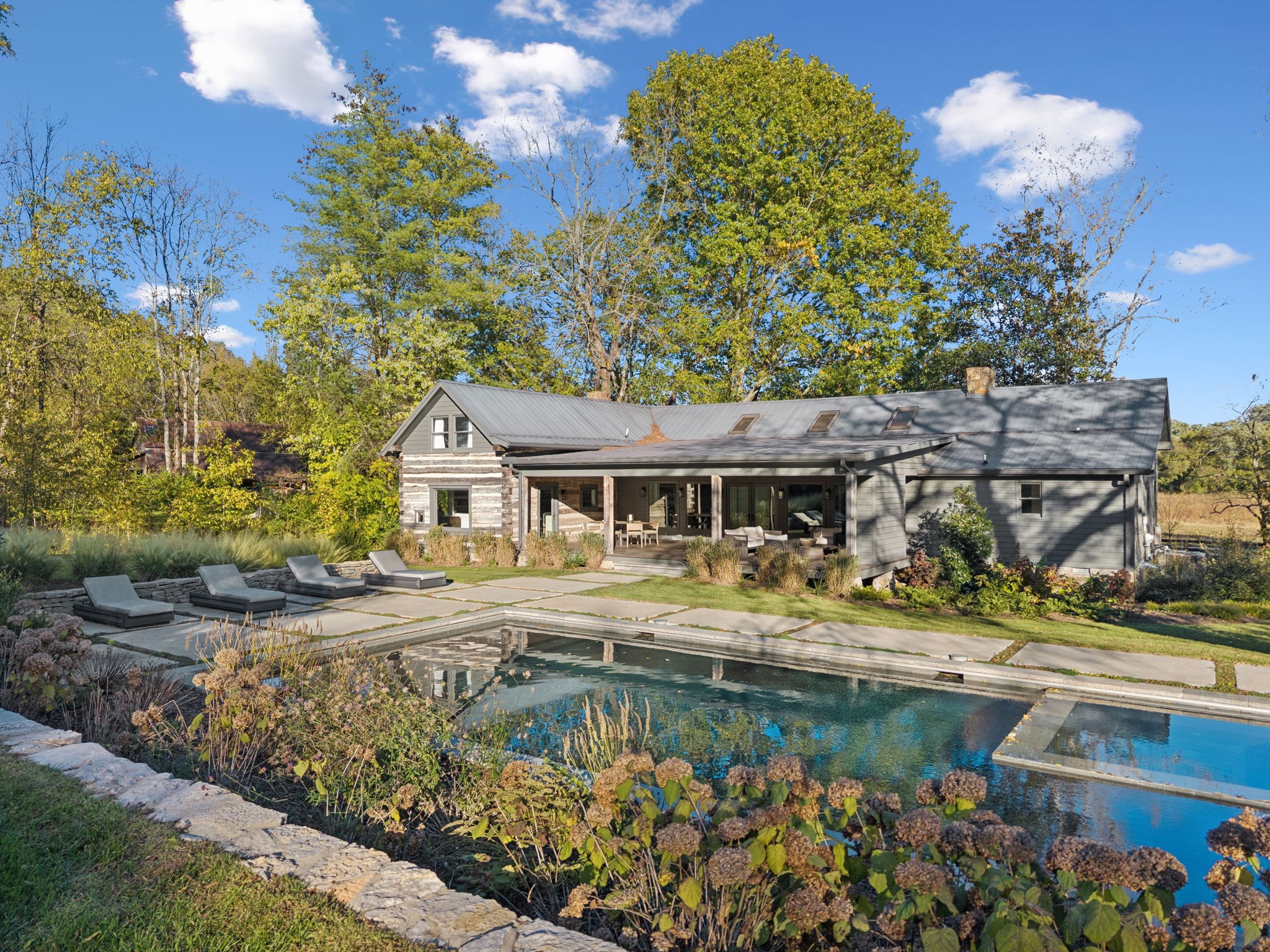 Steeped in history and thoughtfully enhanced, this exceptional offering includes two separate properties totaling 11.1 acres, blending timeless character with modern comforts. Originally constructed in 1806, with notable front additions completed in 1862 and 1865, the main residence showcases original hardwood floors and preserved architectural details that tell a rich story of the past.The listing consists of two distinct homes at separate addresses, providing outstanding flexibility for multi-generational living, guests, or investment potential. The primary residence, located at 2060 Old Hillsboro Rd, features 3 bedrooms, 2 full baths, 1 half bath, and is nestled on 5.08 acres. The secondary property, located at 2064 Old Hillsboro Rd, offers 2 bedrooms, 2 full baths, 1 half bath, 6.02 acres, and is believed to be part of the former Fernvale Hotel, historically serving as a general store.Landscape design curated by Tara Armstrong complements the setting with intentional plantings and a serene approach, accented by a granite lined pea gravel driveway. A heated pool with a full electric safety cover and a covered porch—added just three years ago—create an ideal backdrop for outdoor living and entertaining.Offering privacy, open space, and rare historical significance across two parcels, this one-of-a-kind estate presents a truly unique opportunity to own a special piece of Tennessee history. This property also offers additional soil adequate for a 5-6 bedroom home should you want to design and built your dream home!