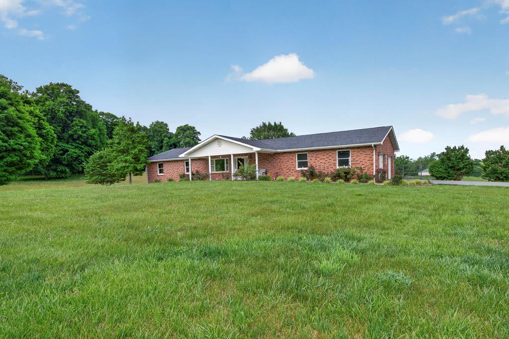 New Price! This is the house with some land out in the country you've been looking for. Situated on 11+ acres, 35383 Widner Valley road offers privacy, space and beautiful countryside views. The gentle lay of the land and the open pasture make this property a great place to start your mini farm. The home is solid and ready for you to make it your own. Features include hardwood floors throughout, a large two car garage and a full unfinished basement. The unfinished basement is a great space that offers additional storage space, a small kitchenette and walkout access to the back yard. You can enjoy the outdoors from the screened in back porch or out in your fenced in back yard. This property is full of potential and is available for the first time.