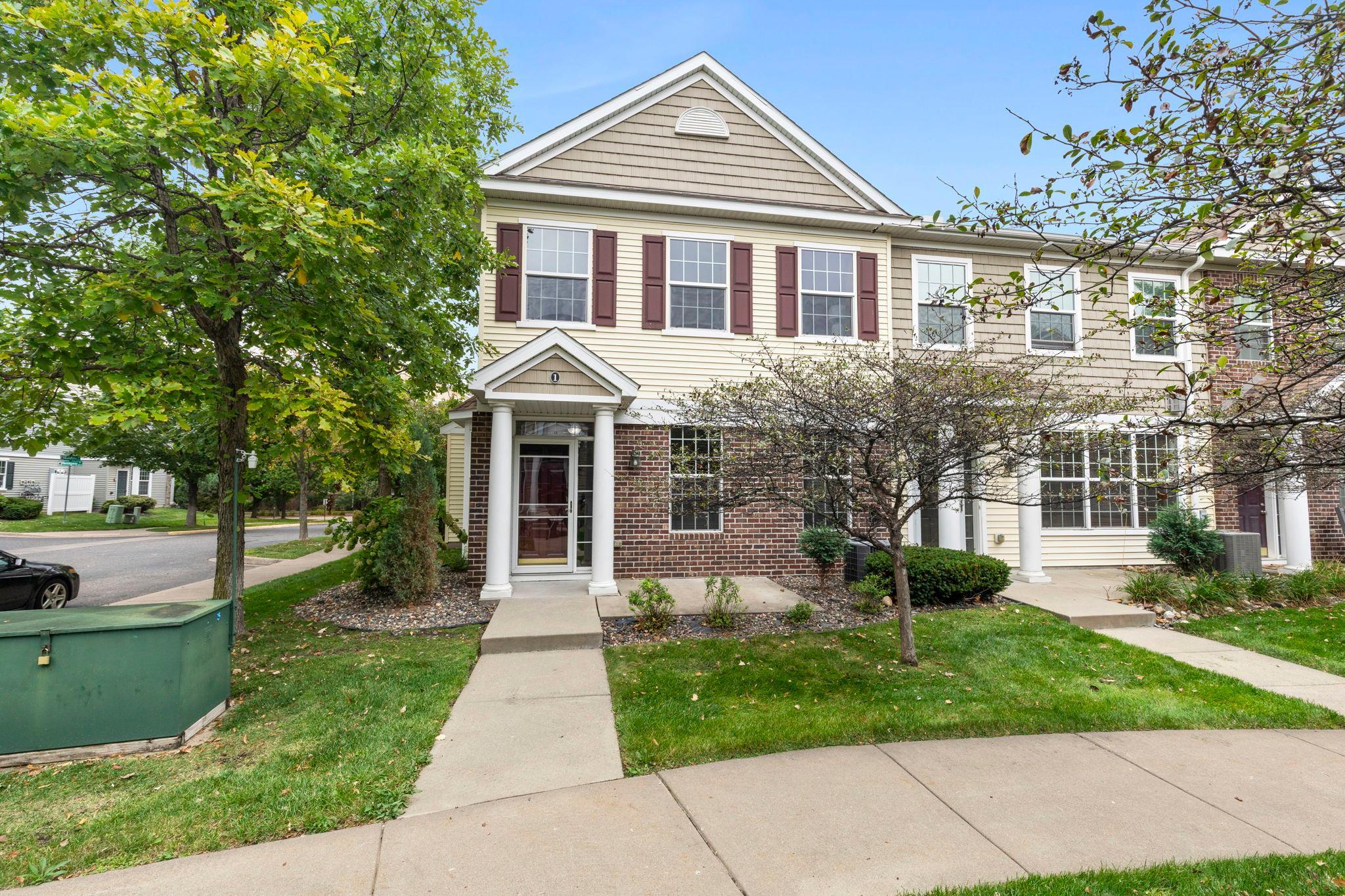 Welcome to this 3-bedroom, 3-bathroom end-unit townhome conveniently located near North Hazelwood Park, Maplewood Mall, restaurants, shopping, and major roads. The bright, open-concept main level features brand-new luxury plank flooring, a spacious kitchen with ample cabinetry, breakfast bar seating, stainless steel appliances, and stylish pendant lighting. The dining area offers large windows, while the inviting living room features a gas fireplace with brick surround and wood mantel. A half bath, storage, and attached 2-car garage complete the main level. Upstairs offers three bedrooms, all with brand-new carpeting, including a spacious primary suite with vaulted ceilings, walk-in closet, and private bath with double vanity. Two additional bedrooms, a full bath, convenient laundry room, and versatile loft space provide plenty of room to live and work. Major updates include a new roof (2022), new siding (2025), and fresh paint and new flooring throughout (2026).