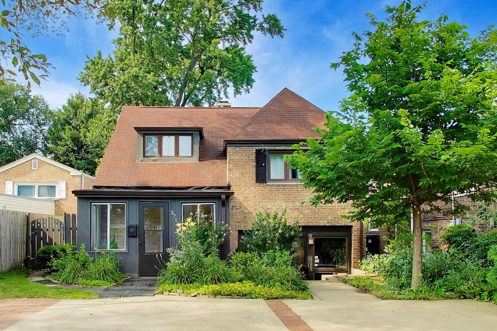 Beautifully reimagined and thoughtfully updated, this 3-bedroom, 2-bath home seamlessly blends classic character with modern day style and functionality. The sun-filled main level welcomes you with hardwood floors, a spacious living room centered around a cozy wood-burning fireplace, and an updated kitchen with subway tile backsplash, stainless steel appliances, abundant cabinetry, and perfectly fits a center island for gathering or morning coffee and breakfast. Options to extend your living surround this main living room with access to all other areas of the home, to the enclosed front glass enclosed porch, the large backyard, the convenient lower level or up to the bedroom levels. Up a short flight of stairs you will find two generously sized bedrooms and a beautifully updated full bath. Retreat just a few extra steps to your own level showcasing expansive primary bedroom offering vaulted beamed ceilings, skylights, hardwood floors, yet still with easy access to the private full bath. The finished walk-out lower level provides exceptional flexibility as a family room, recreation room, home office, larger dining area with easy access to the kitchen, fitness space, or guest retreat with it's own private entrance and full bath. Enjoy having your the enclosed front porch for your own greenhouse, extra space to soak up the sun when you want to keep winter winds off your face, or bonus storage. And retreat to enjoy summer evenings on the rear patio, and an oversized fenced backyard with room to entertain, garden, or play. Major mechanicals and appliances have been updated within the past five years, including 5yr old furnace, A/C, water heater, all kitchen appliances, and W/D offering added peace of mind. LOTS more lovingly cared for updates and upgrades done all in the last 5 years, ask for details. Conveniently located near parks, schools, shopping, dining, and commuter routes, this move-in-ready home offers the perfect combination of charm, space, and modern updates. Come see your new home today!