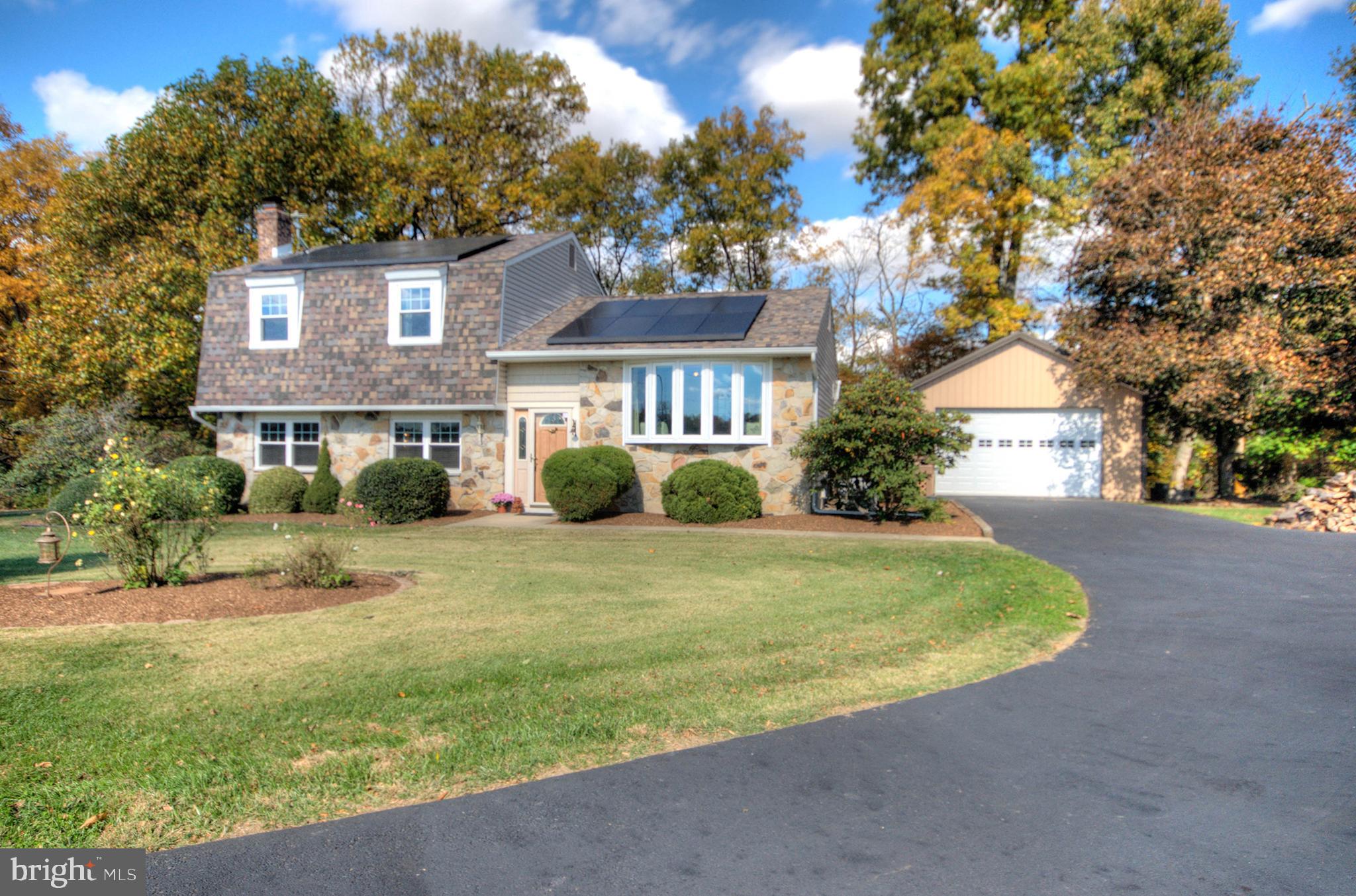 Welcome to your dream home! This property seamlessly blends modern amenities with serene countryside living on 2.4 picturesque acres, nestled amidst protected farmland and offering stunning water views with a creek running through. This stunning residence offers comfort and elegance.The asphalt driveway, paved in November 2024 and sealed in June 2025, leads to an impressive Amish-built barn (2022) with an oversized door, garage door lift, EV charger, and is fully wired. The home features a 30-year roof with 17 owned solar panels (2020).Inside, discover a newly renovated kitchen (2024) with soft-close cabinets, quartz countertops, and updated lighting. Enjoy under-cabinet lighting and new stainless steel appliances (2021) including a gas stove, over-range microwave, fridge, and dishwasher.Relax on the deck (2022, stained summer 2025) or under the awning over the patio (2021). The interior has been recently painted with durable vinyl flooring throughout. The property includes a professionally landscaped perennial garden and a small orchard (Spring 2025) with apple, peach, pear trees and an invisible dog fence around the property.Cozy up by the brick fireplace or enjoy the pellet stove (2024). Additional features include a French drain, sump pump, and central HVAC. The property boasts vinyl windows with a lifetime transferable warranty. Septic, water, and fireplace are regularly maintained.Don't miss the opportunity to make this extraordinary home your own, where modern amenities meet tranquil rural charm, including a hobby farm with chickens and ducks! oh and let's not forget the house GENERATOR too! Schedule your  tour today.