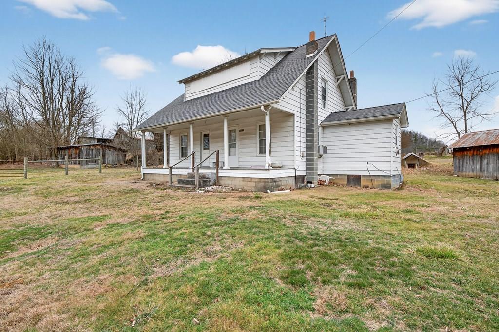 This listing includes the dwelling on 1.4 acres +/-, other acreage is available.  Situated in the scenic countryside of Wideners Valley, this unique property offers the opportunity to own a classic farmhouse and multiple outbuildings suited for a variety of uses. The listing includes a newly surveyed 1.4-acre parcel containing a four-bedroom, one-bath home.  The home features two bedrooms on the main level and two additional bedrooms upstairs. While the house does need work, it provides a solid starting point for those looking to restore a traditional country home or establish a rural homestead. Public water is already connected to the home.  The property is complemented by multiple barns and homesteading-style outbuildings, offering ample space for storage or workshop use.  This property offers space, versatility, and opportunity in a peaceful rural setting.  Please note:  Property has a Chilhowie address, but is situated in Washington County, VA.