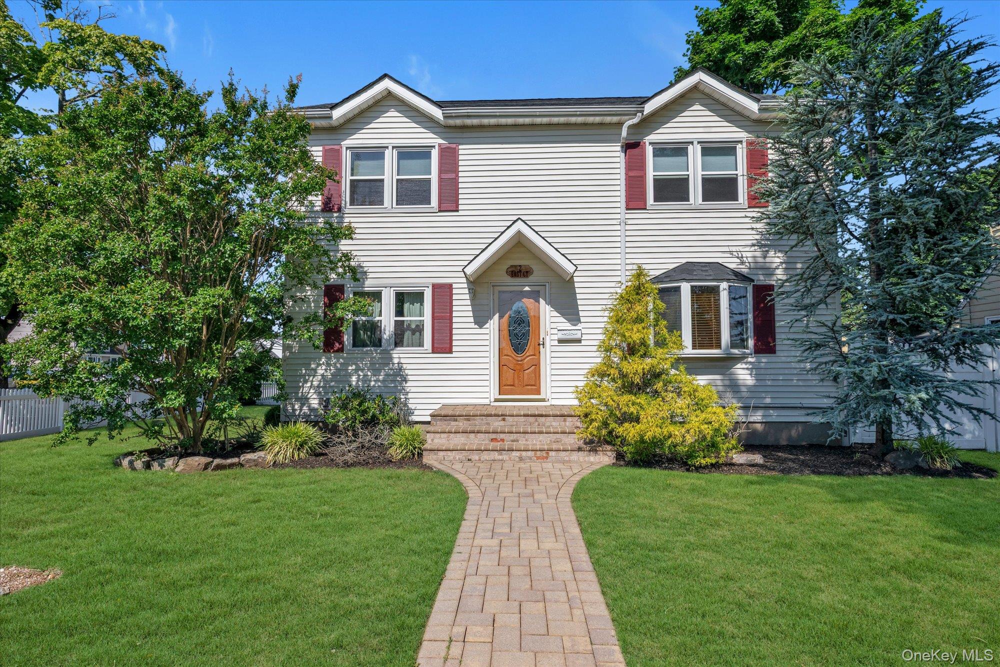 Welcome to 2 East Court in Bethpage, a beautifully maintained Colonial offering 4 bedrooms, 2 bathrooms, and nearly 1,900 square feet of living space on a 6,500-square-foot lot. Thoughtfully updated and designed for today's lifestyle, this home features an open-concept floor plan with a spacious eat-in kitchen showcasing stone countertops, a center island, stainless steel appliances, gas cooking, recessed lighting, and seamless flow into the main living and dining areas.The flexible layout includes a first-floor bedroom and full bath, providing an ideal setup for guests, extended family, or a home office. Hardwood floors, crown molding, and abundant natural light add warmth and character throughout.The second level features three generously sized bedrooms, a full bathroom complete with a jetted tub, and the convenience of a second-floor laundry area. A full basement with a partially finished recreation area and walk-out access to the backyard provides additional living, storage, and entertaining space.Additional highlights include a brand new roof, central air conditioning, natural gas heating, and a detached one-car garage enhanced with plywood-finished walls and a built-in workbench, creating the perfect workshop, hobby space, or storage area. Step outside to enjoy a private backyard featuring a concrete patio, ideal for outdoor dining, gatherings, and relaxation.Conveniently located less than one mile from the Bethpage LIRR station, as well as shopping, dining, parks, and major parkways, this move-in ready home offers the perfect combination of comfort, functionality, and commuter convenience within the highly regarded Bethpage School District. Don't miss this exceptional opportunity to make 2 East Court your next home.