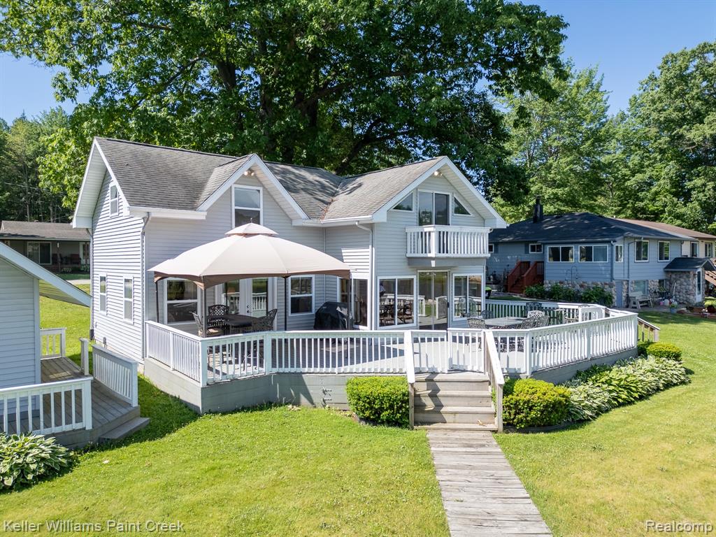 Stunning Secord Lake Waterfront Retreat. Welcome to this charming 2-bedroom, 2-bathroom lakefront home with a dedicated office, perfectly positioned to capture breathtaking views of beautiful Secord Lake. The spacious living room and open kitchen/dining area feature large windows that fill the space with natural light and showcase the picturesque scenery. Step outside onto the expansive deck—ideal for morning coffee, evening cocktails, or gatherings with family and friends. The main level welcomes you with a generous kitchen and dining space, complete with modern appliances, ample counter space, and captivating views of the water. Just beyond, the inviting living room opens directly to the deck, seamlessly blending indoor and outdoor living. Convenience meets comfort with a main-level laundry room, equipped with washer and dryer. Both bedrooms are generously sized, while the two full bathrooms are designed for everyday ease. The dedicated office offers a quiet, flexible space—ideal for remote work, hobbies, or conversion into a cozy guest room. Need extra room for guests or kids? A charming bunkhouse adjacent to the main home provides additional sleeping quarters, complete with heating and air-conditioning—perfect for extended family or a fun retreat for the little ones. Enjoy direct access to the lake with a private dock, ideal for boating, fishing, and swimming. Don't miss your opportunity to own this tranquil lakefront getaway—perfect as a year-round home or weekend retreat! Pontoon boats are cruising the main lake and channels, and full lake levels are expected to return in the summer of 2026. See the FLTF website for all information regarding the dam construction, assessments, and the full lake-level timeline.