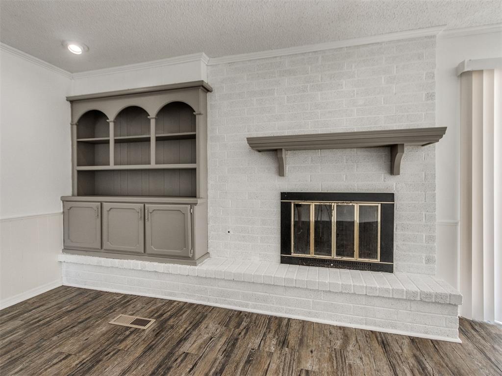 Come see this charming 4-bedroom, 2-bath home tucked away in the popular Crossroads Addition in West Norman! You’ll love being just minutes from Norman’s newest shopping, restaurants, and entertainment while still enjoying the quiet neighborhood feel. This home has a great layout with two separate living areas — perfect for a playroom, home office, or second TV space. The main living room features a freshly limewashed fireplace with painted built-in shelves and a painted mantle, giving the room a warm and updated look. The kitchen offers plenty of counter space and is equipped with a stainless steel dishwasher and double wall ovens — a rare find that makes cooking for a crowd easy. The primary suite is roomy and private, with three additional bedrooms that offer flexibility for kids, guests, or hobbies. Both bathrooms are conveniently located and ready to meet the needs of a busy household. Step outside to find a large backyard with mature trees, offering shade and space to enjoy the outdoors. This home truly has space for everyone — two living areas, four bedrooms, and a big backyard — all in a location that can’t be beat. Schedule your private showing today and see what makes this West Norman property a standout!