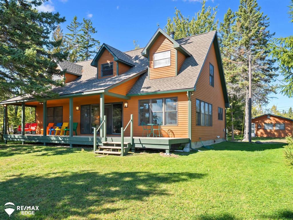 Welcome to 7694 Grand Point Road on picturesque Grand Lake in Presque Isle. Lovingly cared for by one family, this home shows true pride of ownership and has been thoughtfully updated over the past five years with a new dock, sea wall, roofs on the house/garage/shed, a remodeled full bath, skylight, sump pump, and fresh exterior paint. Offered fully furnished - complete with a boat - it's ready for you to step right into the lakefront lifestyle. As a bonus, ownership includes a vacant lot in the Presque Isle Harbor Association, providing access to Lake Huron beaches, a pool, fitness center, tennis, trails, campground, and clubhouse. Whether you're searching for a year-round home or a getaway retreat, this property is a rare chance to experience northern Michigan living at its best.