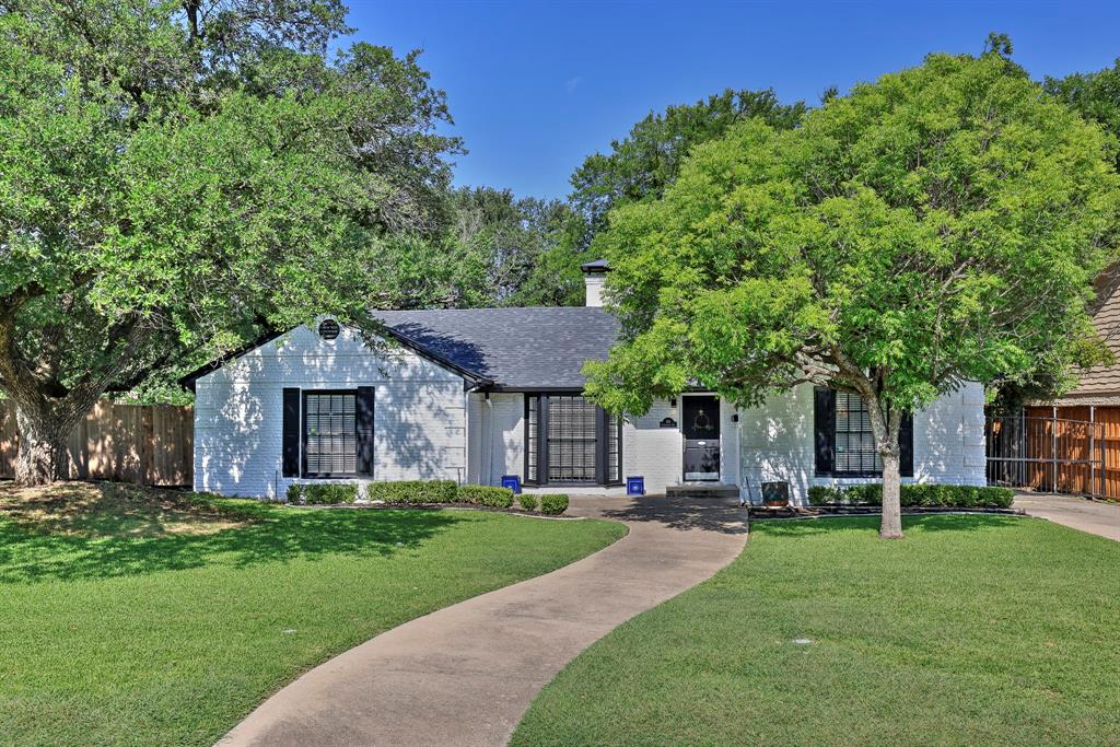 Beautifully renovated and ideally located in the highly coveted Crestwood Addition (76107), this stunning home offers a seamless blend of modern design and timeless charm. Just minutes from Downtown Fort Worth, the Museum District, River District, and Historic Stockyards, the main house features 3 spacious bedrooms, 2 stylishly remodeled bathrooms, and designer finishes throughout its 2,064 square feet. A versatile bonus room off the primary suite makes a perfect office, nursery, or dream closet. The kitchen overlooks a generous 416-square-foot deck, ideal for outdoor entertaining beneath mature trees. Situated on a sprawling corner lot, the property also offers two grassy lawns for pets, gardening, or gatherings. A detached 361-square-foot guesthouse with a full kitchen and bath provides flexible use as a rental unit, home office, gym, or guest suite. Major updates include new bathrooms, HVAC system, roof, fencing, deck, tankless water heater, updated water supply lines, and utility room. Ample parking includes a rear circle drive with gated access from both streets, two-car garage, and additional space for a boat or RV. Sport court options are limitless with room for full-sized pickleball or half-court basketball. Crestwood residents enjoy access to Trinity Trails, a neighborhood park, and a vibrant community. Combined total square footage is 2,425.