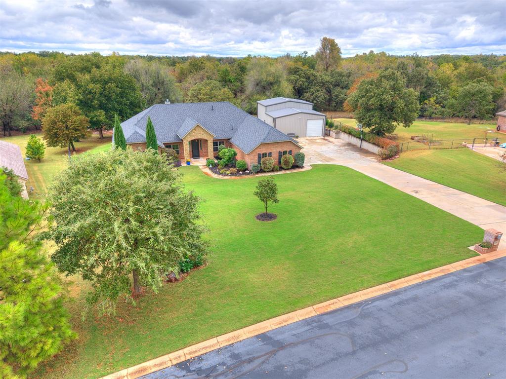 ALL OFFERS DUE WEDNESDAY (Nov 5th) AT NOON. Welcome to 11019 Green Meadows Drive in Edmond, Oklahoma — a custom-built luxury home in sought-after Highland Farms. This beautifully maintained 3-bedroom, 2.5-bath home (with optional 4th bedroom or study) offers nearly 2,750 sq ft of living space plus a 30x40 climate-controlled shop with full bath and loft.

Step inside to an open-concept layout with gorgeous flooring, large windows, and a gas fireplace that create a warm, inviting atmosphere. The chef’s kitchen features a spacious granite island, new stainless steel appliances, gas range, microwave, dishwasher, walk-in pantry, and abundant storage — perfect for family living or entertaining.

The primary suite offers a spa-like retreat with dual vanities, soaking tub, and tiled shower. Secondary bedrooms are generously sized with ample closet space.

Additional upgrades include a heated, insulated 3-car garage with generator switch (2021), in-ground storm shelter, full-yard irrigation, professional landscaping, water softeners (home + shop), and a brand-new roof installed July 2025.

Outdoor living shines with a covered patio, wood-burning fireplace, lighting, and extended driveway with basketball goal — ideal for gatherings. The detached 30x40 shop (built 2021) offers HVAC, full bathroom, RV hookup, EV wiring, 220V power, and plumbing for a kitchenette.

Located in the Edmond North School District, this property includes well water, AT&T Fiber Internet, OGE electric, and ONG gas. The Highland Farms neighborhood features a community pool, playground, and serene countryside atmosphere. Enjoy luxury living in Edmond, OK, where modern comfort meets peaceful country charm!
