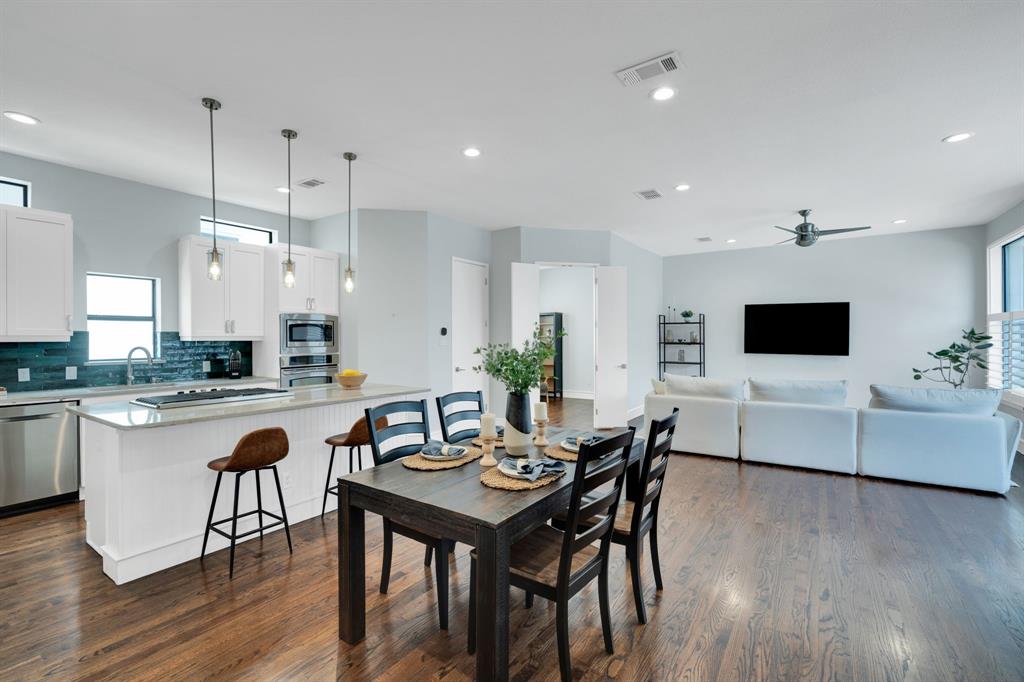 Live at the center of it all in this beautifully updated downtown Dallas townhome within walking distance to top restaurants, parks, nightlife, the Farmers Market, Deep Ellum, Harwood Park and to the Arts District. This home offers the perfect blend of city living and comfort.Hardwood floors run throughout the entire home and have been recently refinished on the second floor along with fresh interior paint completed in 2024. The open kitchen is well equipped with a gas cooktop, stainless steel appliances, Quartzite countertops, LED lighting, and white shaker-style cabinets with hardware. The 2024 refrigerator conveys, along with the washer and dryer. Upstairs, the owner’s suite includes a spacious bathroom with dual vanities, a soaking tub, separate shower, and a walk-in closet with custom built-in features. Plantation shutters, a smart home system, and a tankless water heater add convenience and efficiency throughout.Enjoy a private rooftop that is ready for you to create your dream outdoor space for relaxing or entertaining. With its prime location and modern updates throughout, this home is truly move-in ready.