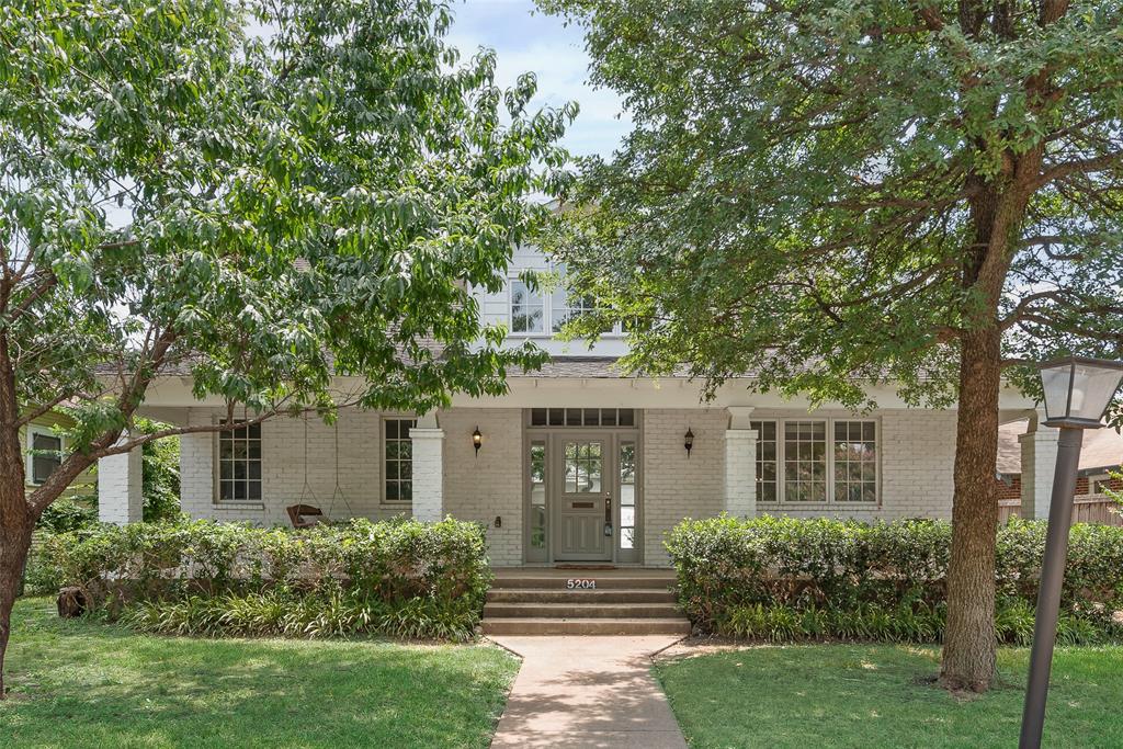 Nestled between the walkable streets of Lower Greenville and the vibrant energy of Knox Henderson, this newer vintage-inspired home offers the perfect blend of timeless charm and modern convenience. Built in 1999 with multiple updates in 2017 and additional upgrades like exterior brick painting, refreshed master shower in 2020, new deck 2025, and paint updates 2025, this home is a true gem for urbanites who love local hotspots, historic preservation, and practical modern living. From the moment you arrive, the welcoming front porch with a charming swing invites you to stay awhile. Inside, soaring ceilings, a sleek switchback staircase with iron railings, and an abundance of natural light create a warm and inviting atmosphere. Gorgeous wood floors flow throughout the home, tying the spaces together seamlessly. The open-concept kitchen boasts a long quartz peninsula, perfect for entertaining, while the living and dining areas offer a stylish yet functional layout. Two spacious bedrooms on the first floor each feature their own bathrooms, offering flexibility and privacy. The second-floor master suite is a luxurious retreat with its own bonus room, perfect for a home office, nursery, or private lounge, along with access to excellent attic storage. The spacious backyard is ready for your outdoor gatherings, and all your favorite Dallas restaurants and shops are just a short stroll away. Two car garage with new opener. This is more than a home—it's a lifestyle. Don't miss your chance to see it!