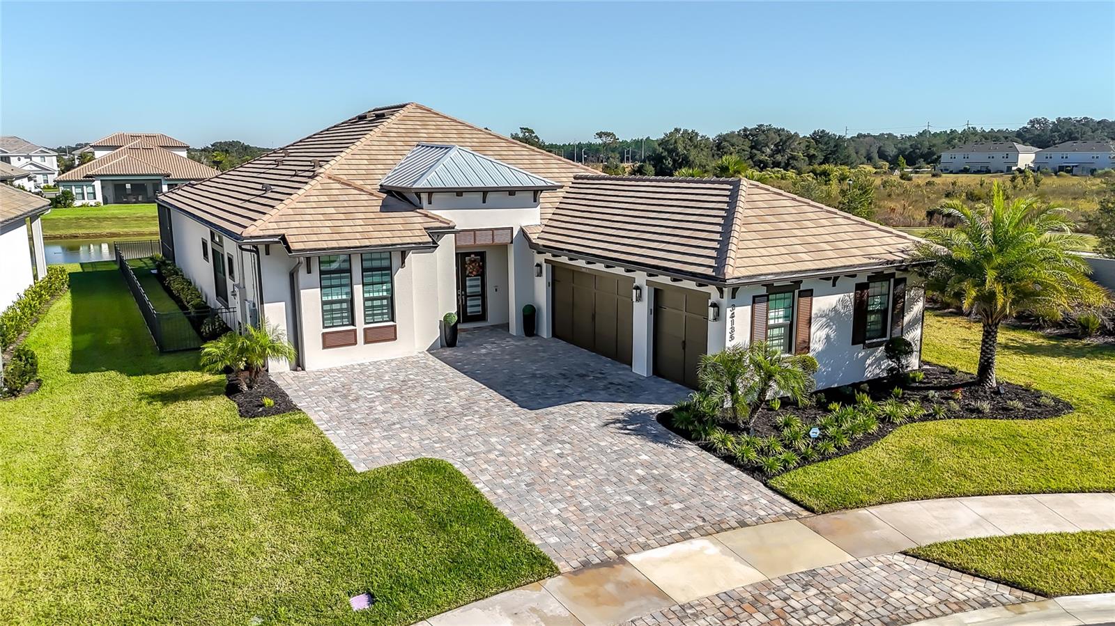 Modern Luxury Meets Smart Living in Gated River’s EdgeThis stunning contemporary home, built in 2023,is semi-furnished, with select furniture included, and is located in the exclusive River’s Edge community of Wesley Chapel. Offering 3,045 sq. ft. of thoughtfully designed one-story living, this residence features 3 bedrooms, a study, 3 full baths, 2 half baths, and a dedicated pool bath.From the moment you step inside, you’ll appreciate the elegant finishes and upscale design—including porcelain flooring, quartzite countertops, Café appliances, European-style doors, and Italian LED fixtures. Every detail has been tastefully curated for style, comfort, and efficiency.Enjoy energy independence with a fully paid 16.81 kW solar system paired with a 30 kW Franklin battery. The saltwater pool and spa feature LED lighting, massage jets, and a natural gas heater, creating a true backyard oasis. Entertain effortlessly with a built-in outdoor kitchen featuring a reinforced concrete structure, granite countertop, natural gas grill, side burner, and smart touchless faucet, perfect for hosting family and friends. Smart-home features abound, including a Tesla EV charger, whole-house SONOS multi-zone audio system, Ring security, and full home automation for seamless modern living.Residents of River’s Edge enjoy access to The River Club, offering a resort-style pool, fitness center, tennis and pickleball courts, dog park, playground, and more.Located just minutes from shopping, dining, and top medical facilities, this home blends luxury, technology, and sustainability to create the ultimate Florida lifestyle experience.(See attached fact sheets for a complete list of upgrades.)