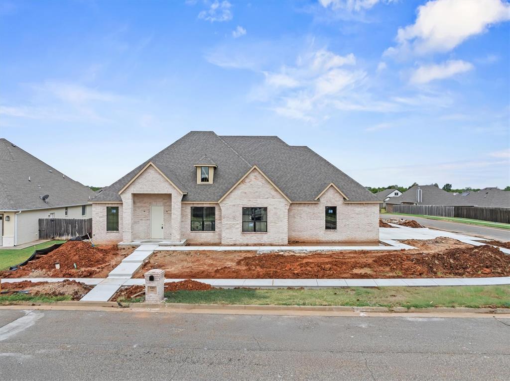 Experience an exceptional quality of this new home at 4201 Bridge Wood Lane in Mirabella, where sophisticated design, elevated finishes, and thoughtful functionality create a home of timeless appeal. A striking all-brick exterior makes an impressive first impression, complemented by professional landscaping, full sod and sprinkler system, and an expansive covered patio with natural gas grill connection perfectly designed for effortless outdoor entertaining. Inside, refined details immediately set this home apart. A dramatic cathedral ceiling crowns the light filled great room, while wood flooring flows throughout the main living areas, primary suite, study, and hallways. Energy efficient Low E windows fill the interiors with natural light, creating an atmosphere that feels both luxurious and inviting. The chef inspired kitchen is designed to impress with quartz countertops, an oversized island, cabinetry extending to the ceiling with glass front upper displays, soft close doors and drawers and generous double pantry storage. The open concept design creates a seamless connection between the kitchen and living spaces, ideal for both intimate evenings and grand scale entertaining. Each bedroom enjoys its own ensuite bath. The primary retreat is a true sanctuary, featuring two oversized separate closets and a spa inspired bath with dual vanities, sleek floating cabinetry illuminated by under cabinet lighting, a freestanding soaking tub, and a fully tiled shower enclosed in frameless glass. Designer details continue throughout with 8-foot interior doors, architectural lighting, sophisticated fixtures, a direct vent fireplace, roof vented kitchen hood, oversized utility room, and abundant storage. The three car side entry garage features Wi-Fi enabled openers and an EV charger. Premium energy conscious features include a tankless water heater, 96% efficient Lennox furnace, enhanced insulation, Low E windows, and Ecobee Wi Fi thermostat. Welcome home!