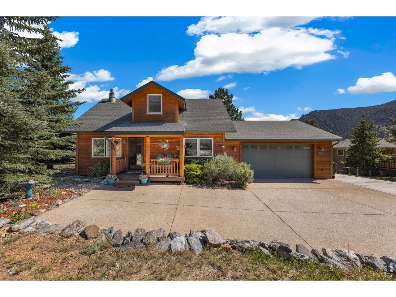 Now offered at an exceptional value in Carriage Hills, this meticulously maintained home combines sweeping mountain views, desirable main-level living, quality updates, and a versatile floor plan to create the ideal Estes Park home for full-time living or a peaceful mountain retreat. The thoughtfully designed layout features a main-level primary suite, a second bedroom and full bath on the main level, plus two additional upstairs bedrooms. A well-appointed kitchen with granite countertops and stainless steel appliances opens to warm, inviting living and dining spaces, highlighted by luxurious wide-plank hardwood floors, vaulted ceilings, and two fireplaces that create an authentic Colorado mountain ambiance. The finished walkout lower level provides flexible space for a family room, recreation room, fitness area, media room, or home office. An expansive deck extends the living space outdoors and provides the ideal setting for morning coffee, outdoor dining, or relaxing evenings surrounded by beautiful mountain scenery. A newer high-end Hot Spring Spas hot tub offers the perfect place to unwind after hiking, biking, golfing, fishing, or exploring nearby Rocky Mountain National Park. Located in the highly sought-after Carriage Hills neighborhood, just minutes from downtown Estes Park, Lake Estes, the golf course, restaurants, shopping, and Rocky Mountain National Park, this home is truly move-in ready. Whether you're searching for a full-time residence, a second home, or a weekend getaway, 715 Ponderosa Lane offers a rare opportunity to own a turn-key mountain home with incredible views in one of Estes Park's most desirable neighborhoods.
