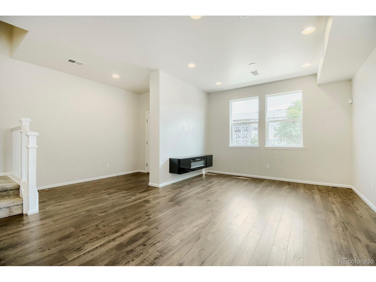 Light, space, and convenience come together in this inviting end-unit townhome - a rare find that checks every box. With the added privacy and natural light that only an end unit offers, you'll immediately notice the difference the moment you walk in.  The open-concept main level is made for living and entertaining, with a flowing layout that connects the living, dining, and kitchen areas seamlessly - perfect for everything from quiet mornings to hosting friends.  Step outside and you're just moments from your favorite coffee shop, local restaurants, and everyday shopping. A nearby neighborhood park adds a wonderful touch of greenery and community, while quick access to major roads and the airport makes commuting and travel effortless.  Your two-car garage gives you the storage and convenience that townhome living doesn't always offer - but this one does.  Whether you're a first-time buyer, a professional on the move, or anyone in between, this townhome delivers a lifestyle that's equal parts comfortable and connected.