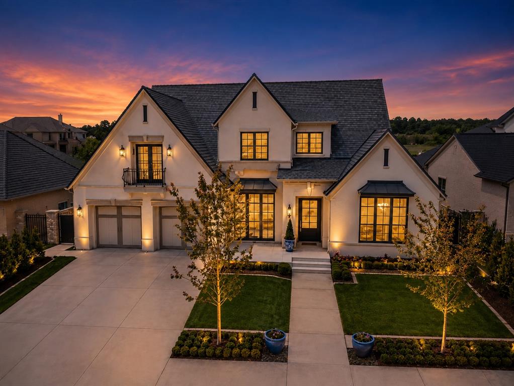 Experience luxury lakefront living in THE VILLAS at ASHTON GROVE...Norman's premier community offering easy luxury living with picturesque lakes, serene walking paths, and gated entries. Now offered at a compelling new price, this stunning home offers a perfect blend of thoughtful design and versatility to fit any lifestyle. A grand entry featuring Monte Cristo iron doors opens to beautiful and flexible living spaces. The library/study has floor to ceiling built-in shelving and opens to the front veranda.  The living area boasts a cast stone fireplace flanked by expansive sliding doors leading to the outdoor living  and overlooking a spacious backyard which easily allows for a pool or water feature. A modern gourmet kitchen offers top-of-the-line appliances and a huge butler's pantry. Featuring 2 ensuite's on the main level, the primary suite offers lake views and a luxurious bathroom and the second ensuite overlooks the backyard and offers patio access. Upstairs discover a cozy reading nook, a spacious flex room showcasing a Juliette balcony overlooking the lake, a beverage center and an ensuite bedroom also enjoys beautiful lake views! There is a large unfinished walk-out attic space that could easily be built out to another bed/bath or used for walk-in storage.  The outdoor living is perfect...with automatic screens, heaters, fireplace and built-in grill. Another great feature is the  oversized garage with a walk-in storm shelter. This thoughtfully designed residence combines versatility and comfort with modern elegance. Every detail reflects quality craftsmanship and timeless design from the soaring ceilings, hardwood floors, designer lighting, custom cabinetry, premium finishes and expansive windows that fill the home with natural light while framing picturesque views!  Experience easy luxury living at its finest in Ashton Grove! Conveniently located in NW Norman.