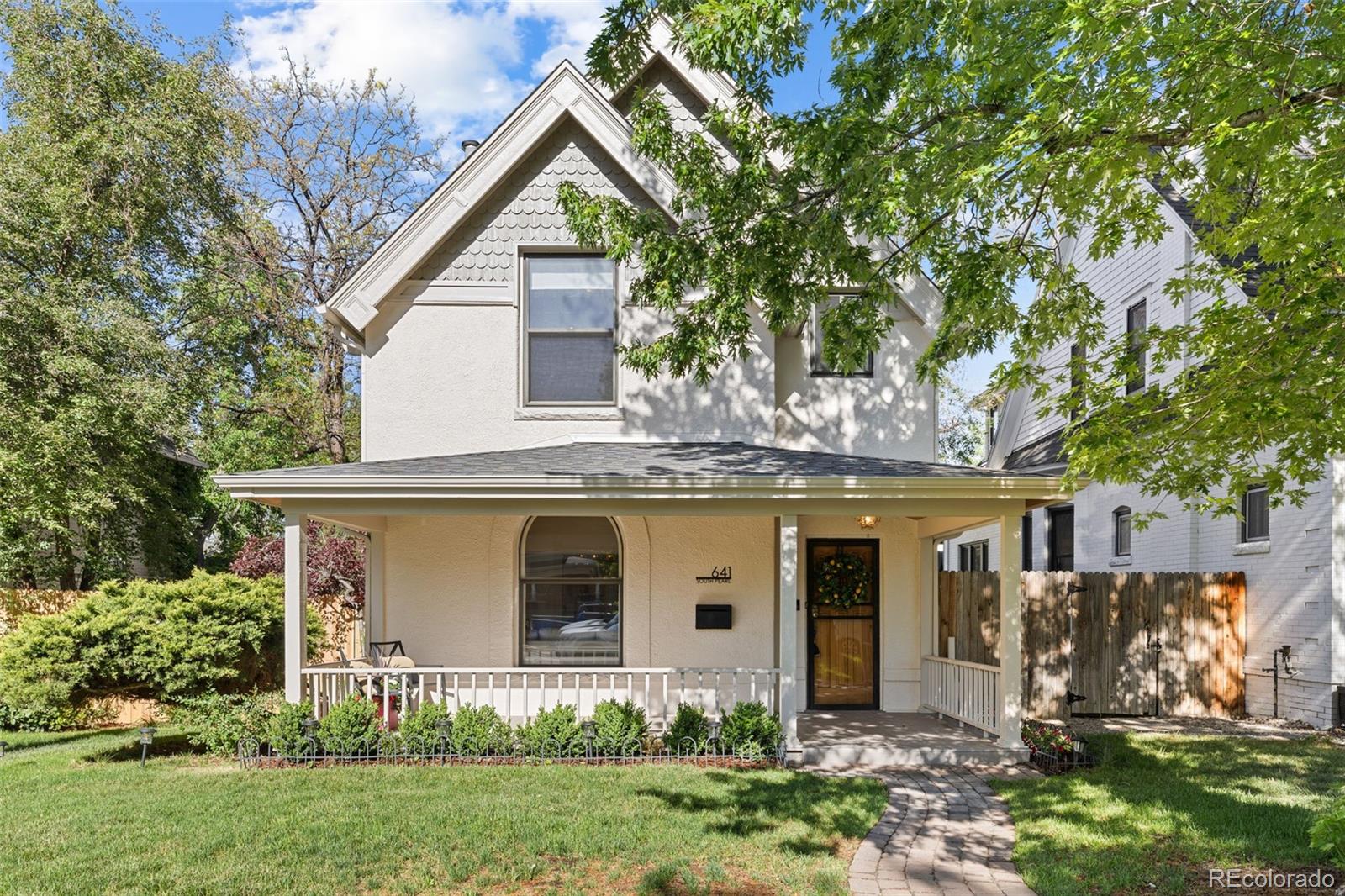 OPEN HOUSE Saturday, May 23rd 12-2.Historic West Wash Park charm meets a masterful top-to-bottom 2024 renovation. This rare offering delivers the timeless character of a classic Denver home with the precision, systems, and finishes of a new build—all situated on an exceptional double-sized lot.A large covered front porch leads to a dramatic entry featuring an exposed brick feature wall and a natural stone gas fireplace. The open main level boasts natural white oak floors and custom-milled baseboards that preserve historic detail. The designer kitchen is a showstopper, featuring custom wood brushed-glaze cabinetry, quartzite countertops, Monogram appliances, and a custom hood. Experience ultimate indoor-outdoor living with a wall-to-wall NanoWall that opens completely to a wrap-around deck. The main floor is rounded out by a full bath and a flexible bonus room—perfect as a 4th bedroom or executive office.The upper level offers three bedrooms, including a primary suite retreat with vaulted ceilings and a spa-like bath featuring dual rain showerheads, a soaking tub, Kohler fixtures, and heated floors. Organization is effortless with his-and-her California Closets and a rare upper-level laundry room. Luxury tile from Ann Sacks and Porcelanosa adorns the bathrooms, two of which feature heated flooring.Complete peace of mind: All-new plumbing, electrical, HVAC, designer lighting, and structural basement upgrades for ample storage.The outdoor space is a private oasis with an expansive yard, new fencing, and a two-car garage. Future-proof your investment: The lot is already rezoned for an ADU, and architectural drawings for a 2-bedroom ADU with garage and office space are included.A rare West Wash Park opportunity—historic soul, modern luxury, and future flexibility in one exceptional home.