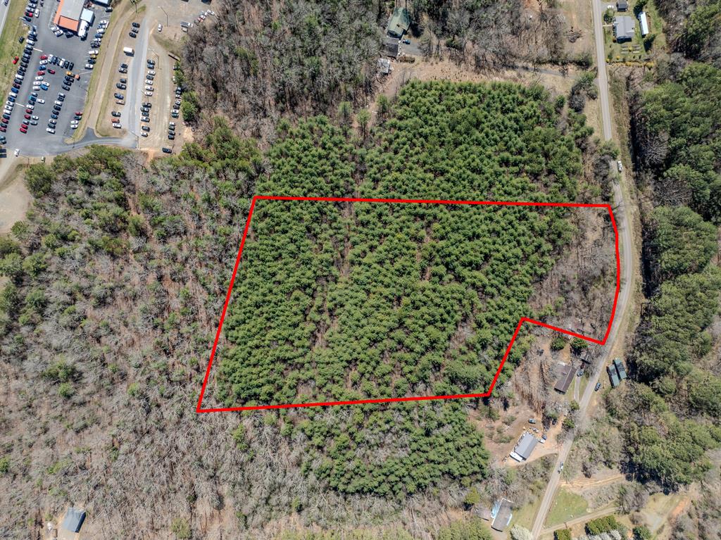 8.3+/- acres of UNRESTRICTED land minutes from downtown Murphy and lake Hiwassee, property has 4 unexpired, 2 bedroom septic permits- (valid until 2029+/-) . As well as possible perpetual access to a spring on a nearby property per deed reference! Buyer agent to verify As well as survey of property of how it could be divided into lots - great for developers looking for a great investment! Gentle land at bottom of lot next to Old Murphy Road for easy access. Great site for an RV, Homesite, developer or possibly even a  business. Possible views on the ridge top at back of property. Directly across the road is USFS where the Nottley River meets Lake Hiwassee, great opportunity to kayak, boat, fish and hunt. Note: **No existing internet on property at this time, buyer encouraged to verify internet/wifi options for property** Tax amount is from 2024 and is subject to change.