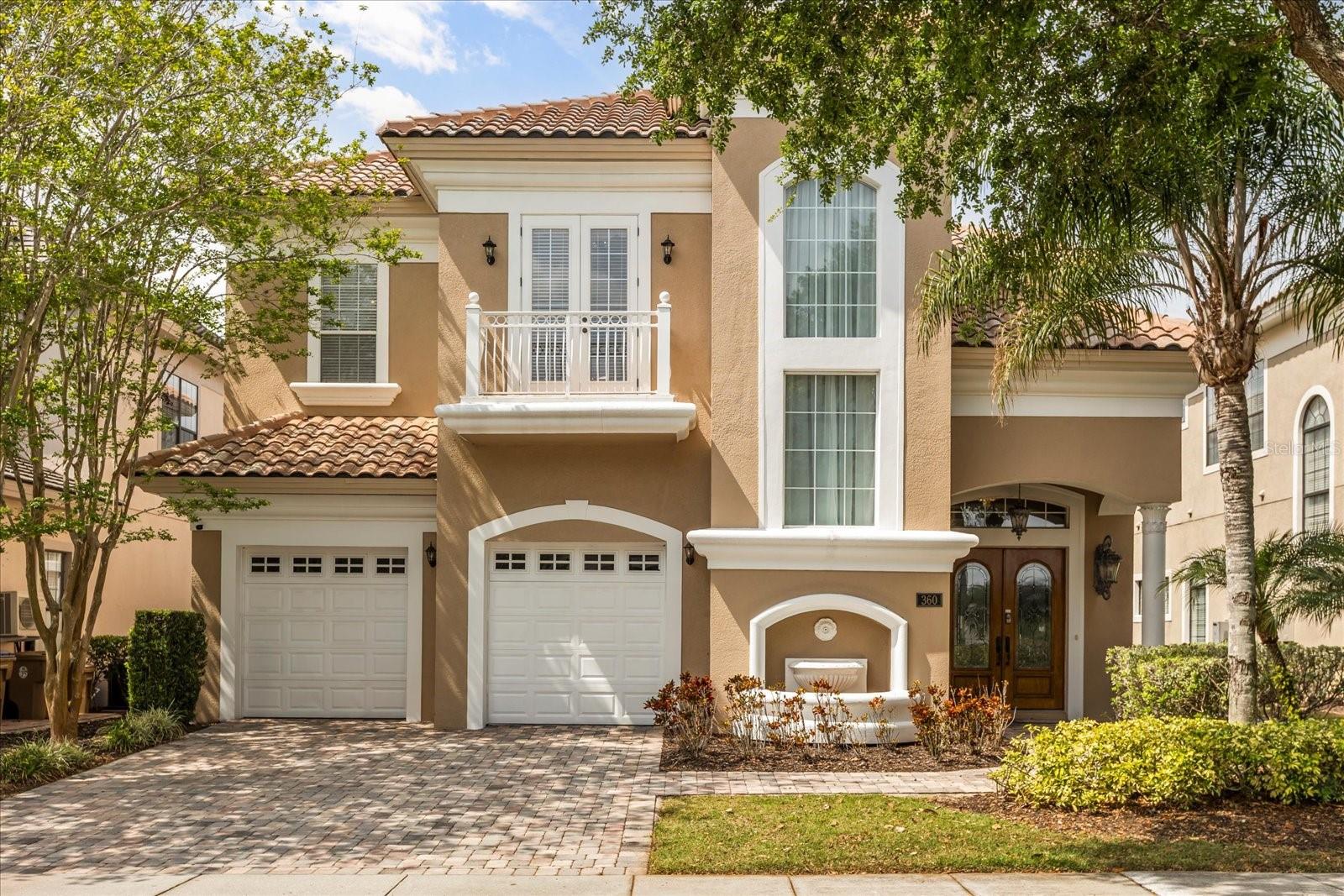 Welcome to 360 Muirfield Loop, an immaculate home that offers stunning GOLF VIEWS of the 10th fairway on the signature Jack Nicklaus course. This professionally decorated FULLY FURNISHED home features high ceilings and a thoughtfully designed layout, creating a space that's as functional as it is beautiful. Upon entering, you are greeted by a spacious living area that includes custom built in shelves with a cozy gas fireplace, seamlessly connecting to the formal dining area which boasts seating for 10 guests and a dual-temperature wine refrigerator. The open-concept design flows into a chef’s kitchen equipped with a large island with seating, stainless appliances, stone countertops and custom hardwood cabinets with crown molding that adds a touch of elegance. Recent updates to include a NEW refrigerator and dishwasher. There is also a charming breakfast nook offers the perfect spot for casual meals. Adjacent to the kitchen is a second living area ideal for relaxing or entertaining. Additionally there is a first floor guest suite that in en suite providing a welcomed sense of privacy for guests. The upstairs features two expansive primary master suites, both with access to a balcony overlooking the expansive pool deck and the golf course. Each  primary suite offers dual sinks, a garden tub, a shower, and large walk-in closets providing a private and luxurious retreat.  The remaining two guest suites are also en suite and are themed with Princess and Stars Wars decor. There is ceramic tile throughout, NO CARPET that adds a clean, sleek feel, while the hardwood stairs elevate the overall design. Entertainment options abound with a professionally designed, themed game room, complete with arcade games, foosball, a pool table, and a poker table, ensuring fun for all ages. Step outside to the spacious pavered pool deck, where you'll find a covered lanai with a summer kitchen equipped with a BBQ grill, refrigerator, and wet bar. A professionally constructed covered seating area was added and provides the perfect spot for hours of outdoor enjoyment. The saltwater pool and jacuzzi complete this backyard oasis, offering relaxation and entertainment all year round. The laundry room located on the 2nd floor is equipped with a NEW washer and dryer, along with built-in cabinets and a sink for convenience. Additional features include bluetooth surround sound throughout the home and there are also five exterior cameras for added security. This home offers a perfect blend of luxury, comfort, and style, making it the ideal place to live, entertain, and enjoy life to the fullest. Don’t miss the opportunity to make 360 Muirfield Loop your forever home! It is a great opportunity to make this your primary, second home, or investment property! Reunion Resort is a one of a kind 2300 acre Resort and Golf community that has many amenities including a water park complete with water slides, lazy river, zero entry pools & food and beverage service, 3 award-winning golf courses designed by the legends of golf (Palmer, Watson & Nicklaus), 11 pools throughout the community, mini putt putt golf, world class tennis courts, pickleball courts, playgrounds, dog parks, golf cart & bike rentals and several on-site restaurants to include fine dining. Reunion Resort is located just 6 miles to Disney and the parks, and a short drive to the Orlando International Airport