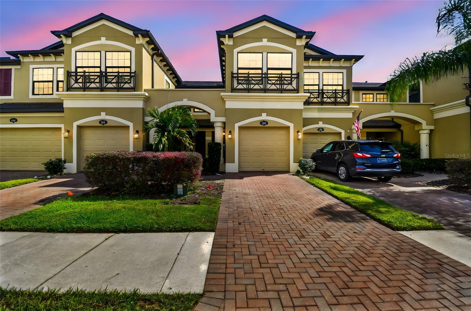 Welcome to Long Lake Ranch! This 2-bedroom, 2.5-bath townhome with a 1-car garage was built in 2018 and still shows like new, offering an open layout with tall ceilings, wood-look tile floors on the main level, and plenty of natural light. The kitchen is both stylish and functional with stainless steel appliances, Cambria countertops, rich cabinetry, and a spacious breakfast bar that flows into the living area. Upstairs you’ll find a versatile loft, a primary suite with dual walk-in closets and private bath featuring dual sinks and a large walk-in shower, plus a second bedroom, full bath, and laundry. A newly enclosed patio adds extra space for relaxing. Residents of Long Lake Ranch enjoy resort-style amenities including a pool, splash pad, playgrounds, dog park, tennis and basketball courts, all just minutes from top-rated schools, shopping, dining, and  an easy commute to Tampa.