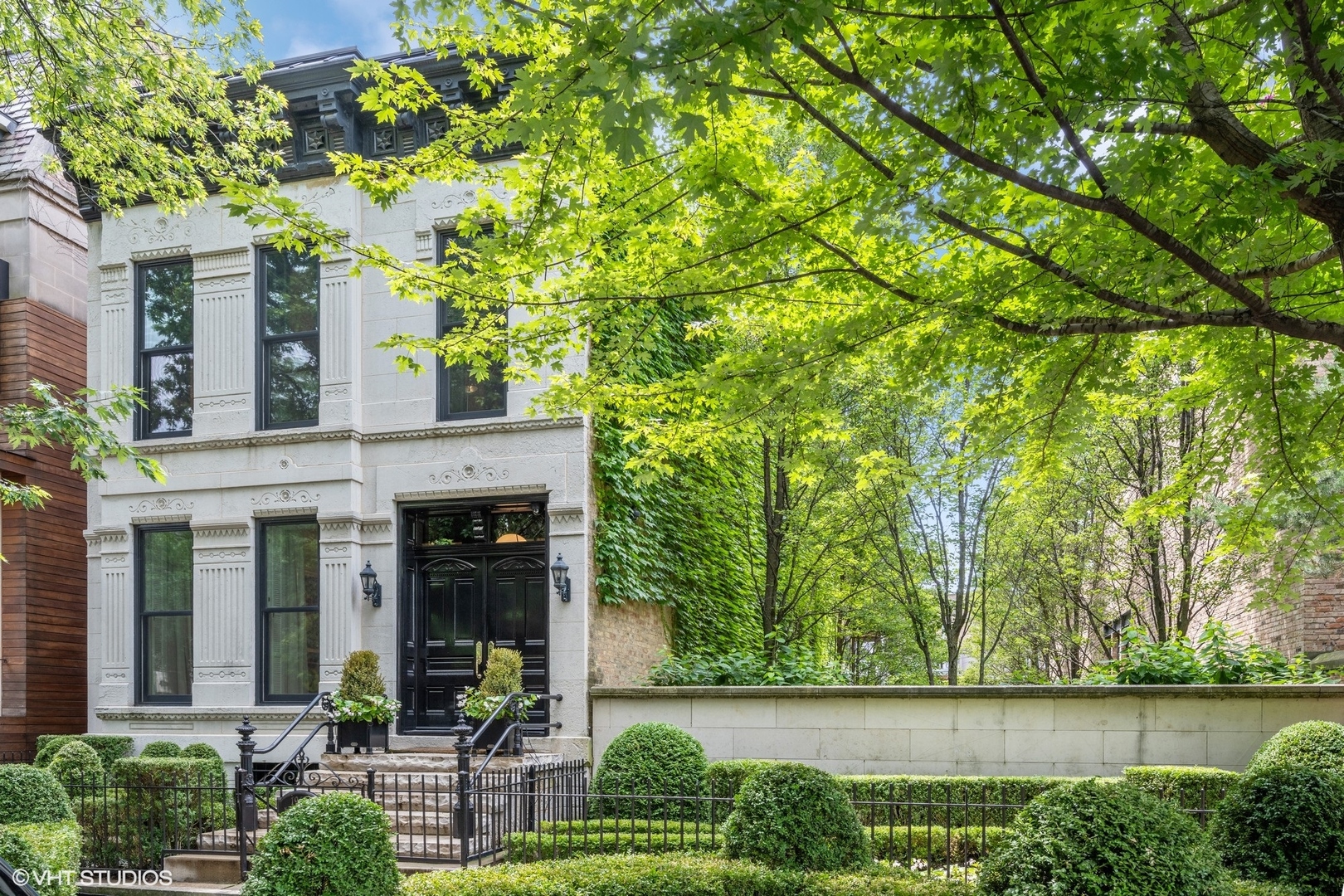 This East Lincoln Park crown jewel marries history and architectural significance with luxurious interiors. The home is located on a double 50 x 123.4 lot. This Italianate-style residence at 1964 North Burling was originally built in 1883 as a single-family home on a former nursery and horse truck farm. It is part of the Sheffield National Register Historic District and, significantly, is rated Orange in the Chicago Historical Resources Survey. The current owners meticulously restored this limestone-and-brick home with successive renovations by Bulley & Andrews in the subsequent years  to maintain its impeccable condition. The gorgeous decor, designed by Alessandra Branca, was featured in House Beautiful and Veranda magazines and may be sold vacant or fully furnished. Stepping through the front double doors, you'll find French maple chevron floors, working marble fireplaces, and rooms lovelier than the last. The gourmet kitchen features cerused white oak cabinetry, marble countertops, and top-of-the-line appliances, including a Thermador double oven and Sub-Zero refrigerator. A spacious butler's pantry with a stainless-steel wet bar adds an extra layer of convenience. The attached garage, with a side door entrance, offers direct access to the home and extends its length. A terrace above the garage can be reached from the family room and leads to a beautiful side yard and basketball sport court-ideal for both relaxation and recreation. Double staircases connect the upper and lower levels, creating excellent flow throughout the home. The spacious primary suite includes a large dressing room, double walk-in closets, and a luxe bath with marble and silver finishes. Two additional bedrooms and a convenient laundry room complete this level. The third floor is an entertainer's dream, featuring a penthouse lounge with a full working bar and a second terrace for the perfect outdoor retreat. Another bedroom and full bath provide flexible space for guests or a private oasis. The lower level was designed with both comfort and entertainment in mind, offering heated floors, a fifth bedroom or office, a media room, a recreation room with built-in desks and bookcases, a wine cellar, and a steam/infrared sauna shower. Additional details and upgrades are available in a fact sheet upon request. Notably, there is potential for elevator installation on the southeast corner of the home, and square footage could be expanded if desired. The property currently includes a two-car attached garage plus a two-car parking pad. Enjoy tree-lined, quiet walks along some of Lincoln Park's most beautiful blocks, as well as the convenience and energy of shops and restaurants in the prime Armitage and Halsted area. A truly breathtaking home in the perfect location!