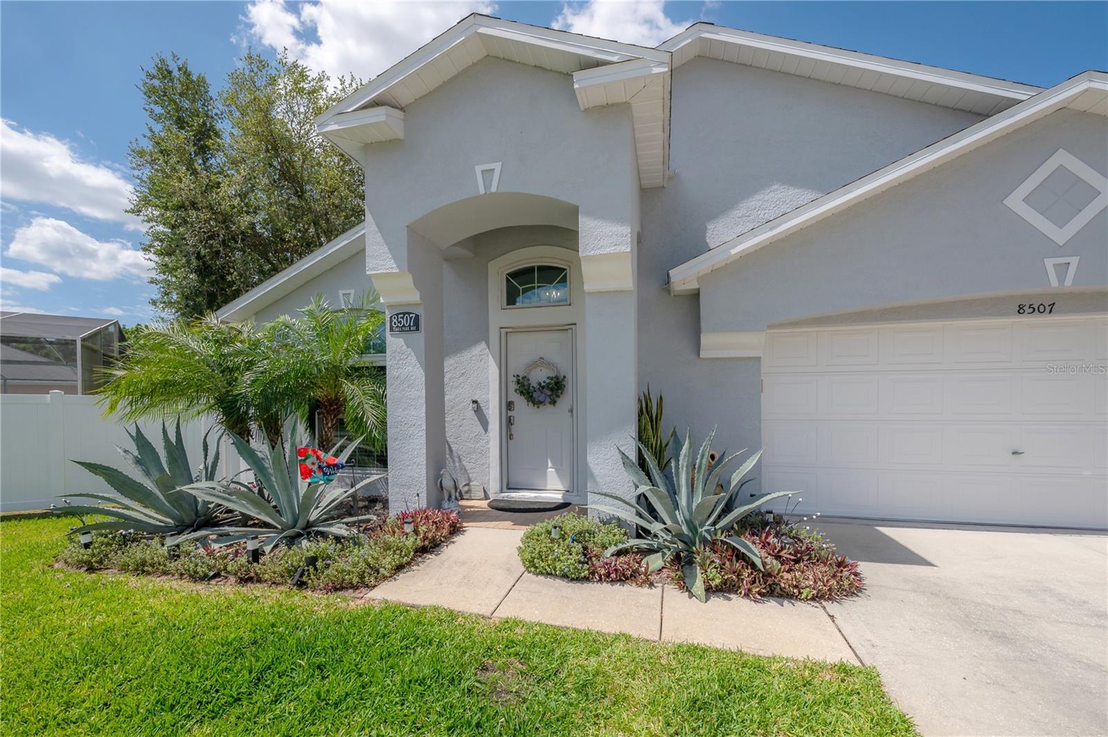 Welcome to a home that truly lives large — thoughtfully updated and tucked inside a community known for remarkably low HOA dues. With dues of just $832/year, you’ll enjoy access to a community center, pool, playground, and tennis courts, giving you a full range of amenities without the usual high price tag of other surrounding communities. Inside, the layout is designed for exceptional flexibility, with every square foot put to smart use. The current owners have shaped the common areas around the way they live — dining is in the space traditionally used as the family room and turning the front living/dining area into a TV room and workspace. It’s the kind of floorplan that easily shifts with you, whether your days revolve around entertaining, relaxing, or working from home. At the center of the home is a fully remodeled and expanded kitchen, finished with high-quality quartz countertops, soft-close wood cabinetry, and stainless steel appliances. It feels open, bright, and genuinely functional. Just off the kitchen, the laundry room doubles as a mudroom, adding a layer of everyday convenience. Both bathrooms have been updated, and the primary bathroom has similar high-quality cabinetry and counters as the kitchen, creating a cohesive, modern feel throughout the home. Major updates bring you peace of mind: roof installed 2017, hurricane-impact windows and doors, updated HVAC, and an updated water treatment/softening system. Inside, luxury vinyl flooring runs throughout, paired with energy-efficient LED lighting for a clean, contemporary look. Outdoor living is just as inviting. A screened and covered rear patio opens to a brick-paver surround, giving you extra space for relaxing, dining, or entertaining. It’s private, low-maintenance, and comfortable year-round. And the location is one of the biggest advantages. This home sits near the highly desirable Westchase and Oldsmar areas, placing you close to everything from top-rated schools to golf courses (Rocky Point Golf Course - part of the Florida Historic Golf Courses - about 10 minutes away), parks, and water-sport opportunities along the bay. Everyday essentials are just minutes away — including Publix, Costco, Target, Westchase Town Center, and locally-owned shops and restaurants. Commuting is simple with quick access to the Veterans Expressway, and you’re a short drive from Tampa International Airport, major hospitals, and some of Tampa Bay’s best outdoor recreation spots (public boat ramp and a beach only about 10 minutes away!). If you’re looking for a home with thoughtful updates, flexible living spaces, and a location that puts everything within reach, this one is worth a closer look. Move-in ready, beautifully improved, and designed to make everyday living easier — it’s a rare find in a sought-after neighborhood.