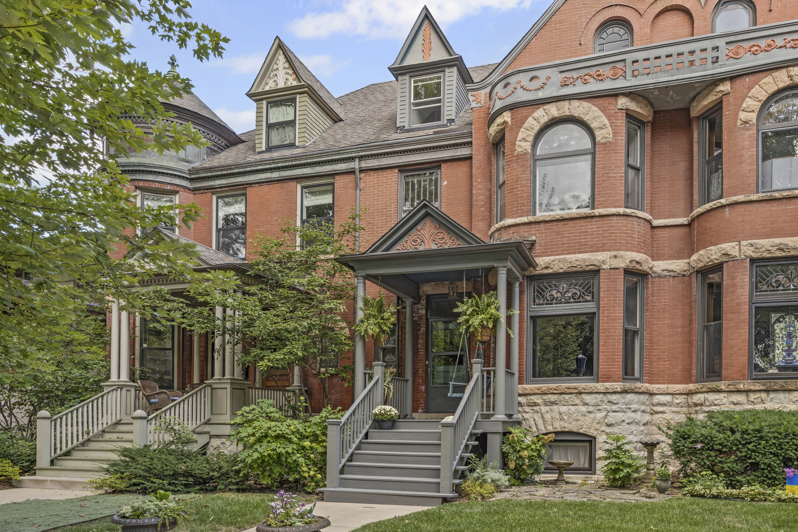 Rarely available, this single family row home (designed in 1891 by Architect William Van Kuren) offers the perfect blend of historic character and modern lifestyle with an additional income producing space! Be only the fourth owner of this timeless property ideally located in the heart of the Frank Lloyd Wright Historic District and moments away from downtown Oak Park. Lovingly maintained and thoughtfully updated, this property features striking original architectural details: exposed brick foyer with a two story staircase, quarter sawn oak floors, ten foot ceilings (some coved) pocket doors, period light fixtures, Trent tile decorative fireplace, plus sweeping views of Austin Gardens from the striking front room picture window. This home's kitchen also lends character with original MCM Sears & Roebuck cabinets, steel-rimmed Formica counters, and its sunshine-yellow vintage cast iron Chambers range. An oversized schoolhouse light helps blend mid-century charm with 1890s architecture. Four second floor bedrooms and a primary suite on the third level offer space and flexibility. With a private rooftop deck, original wide-plank flooring, and a vintage-inspired modern bath, the third floor will surely be one of your favorite spaces. The lower level is currently used as an Airbnb with its own private entrance. It features two additional private bedrooms, kitchenette, a bathroom, office and a common area. This space  generates $30,000 annually, but could easily be converted to nanny's quarters or used as additional rooms for houseguests.       This home is more than just a residence - it's an historically significant package delivering architectural integrity and accessibility to a vibrant neighborhood. From its original design to its passive income stream and proximity to schools, Oak Park's cultural and dining scenes, and public transportation, this property offers a once-in-a-lifetime opportunity.