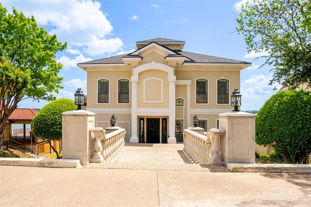 The Ultimate Lake Home - Walls of glass on all levels overlooking the main body of beautiful Lake Granbury. This unique home is the perfect place for entertaining or just enjoying the beauty and comfort of lake living. 3 levels of living featuring 2 living areas, 4 bedrooms, 4+ baths, 2 balconies, extensive covered patios, large boat dock with electric lifts. The community offers 24 hour gated security, 2 golf courses, marina, private clubhouse & more.