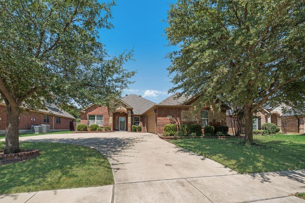 Welcome home! This 3 bedroom, 2 bath home offers a spacious and flexible floor plan with fresh interior paint and new laminate flooring throughout the main living areas and bedrooms. The home features two living areas, giving you the option to use the additional space as an office, sitting area, playroom, or flex space.The main living area features a fireplace, ceiling fan, and plenty of natural light. The kitchen offers granite countertops, stainless steel appliances, plenty of cabinet and counter space, a pantry, and openings overlooking the living and dining areas. A separate dining area provides additional space for everyday meals or entertaining.The spacious primary bedroom includes an ensuite bathroom with dual sinks, a separate shower, garden tub, and a large walk-in closet with built-in storage. Two additional bedrooms and a second full bathroom complete the floor plan.Additional features include crown molding, tile flooring in the kitchen and dining areas, a covered back patio, fenced backyard, and attached two-car garage. Fresh, clean, and ready for you!
