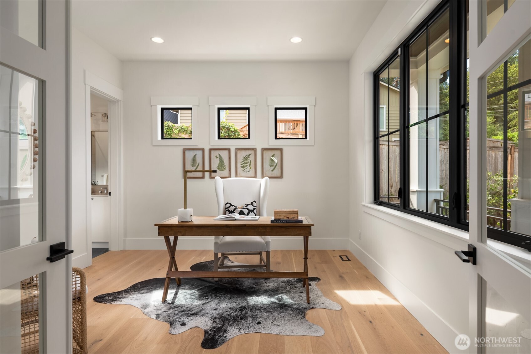 Bright home office with large windows.