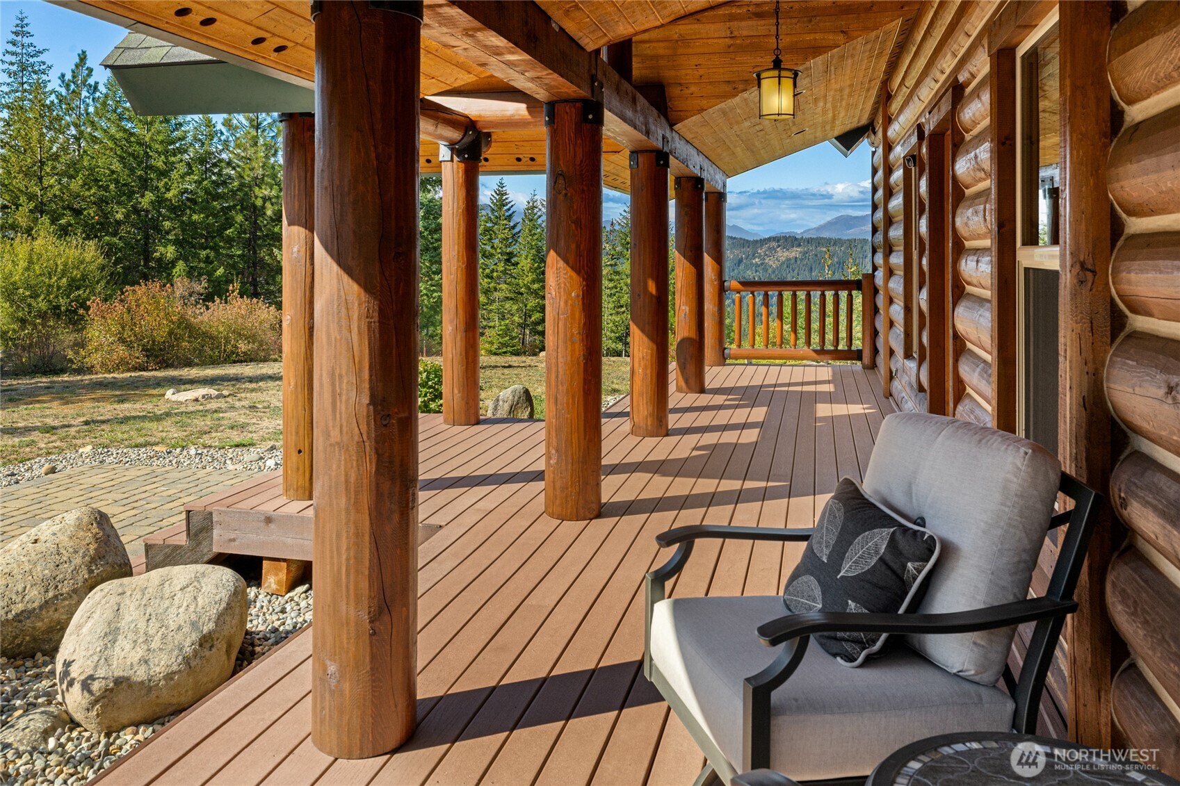 One of four distinct porches offering multiple places to relax outdoors and enjoy the home’s peaceful mountain setting.