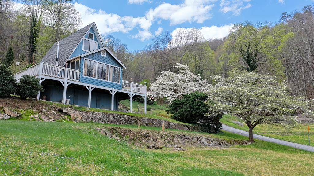 Escape to this charming A-frame cabin nestled in the heart of Fontana Dam, where breathtaking Smoky Mountain views meet peaceful seclusion. Thoughtfully designed with a stylish mid-century modern touch, this cozy retreat is the perfect blend of comfort and character.  Step inside to discover a warm and inviting space featuring a fully equipped kitchen, comfortable living area, and large windows that bring the beauty of the outdoors in. Whether you're enjoying your morning coffee on the deck or unwinding after a day of adventure, this home offers a serene escape from the everyday. Located just minutes from hiking trails, Fontana Lake, and the Great Smoky Mountains, this property is a dream for nature lovers and outdoor enthusiasts alike. Spend your days exploring scenic trails, fishing, or simply soaking in the mountain air.