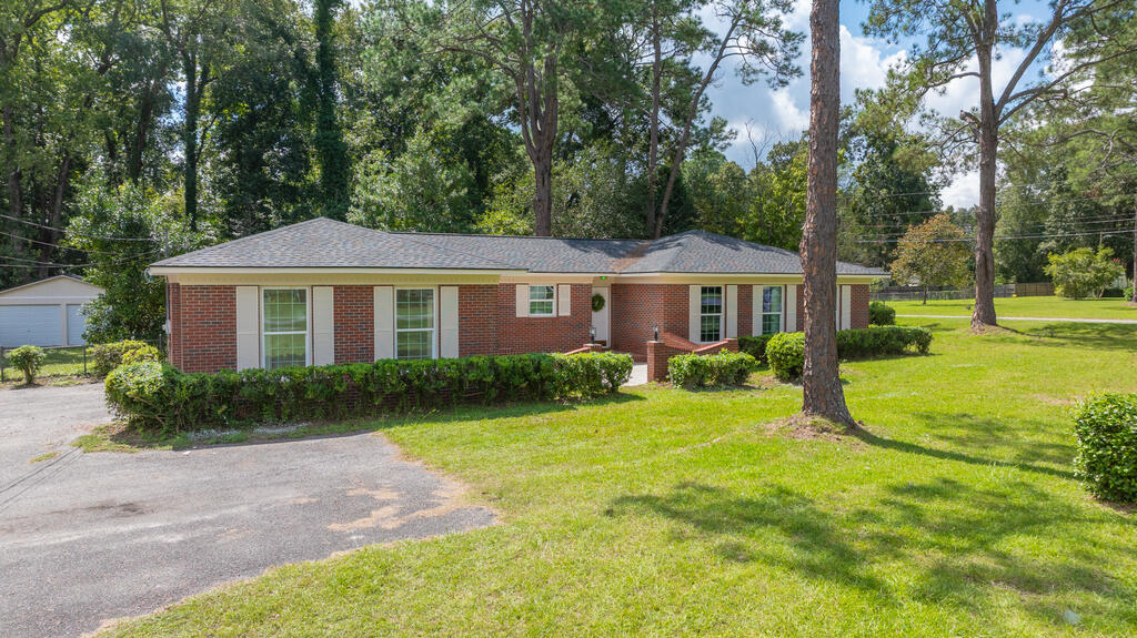 Move-in ready and beautifully updated, this 3-bedroom, 2-bath brick home offers a great combination of classic charm, modern finishes, and plenty of outdoor space. The home has been remodeled and freshly painted, with updated flooring, recessed lighting, and a bright, neutral color palette throughout. Inside, you'll find spacious living and dining areas filled with natural light, along with a beautifully updated kitchen featuring white cabinetry, granite countertops, generous workspace, and room for a breakfast table. Appliances to be chosen by buyers, and provided by sellers with satisfactory offer. The bedrooms are comfortably sized, and the updated bathrooms include clean, modern finishes, including a double-sink vanity in one bath. Outside, mature trees and established landscaping create a welcoming setting, while the in-ground swimming pool provides a great place to relax or entertain. The property also features an attached covered carport, a detached two-car garage for additional parking, storage, or workshop space, and a laundry room conveniently located in the garage. With its solid brick exterior, spacious yard, updated interior, pool, and abundant parking and storage, this home has a lot to offer. Schedule your showing today and come see it for yourself!
