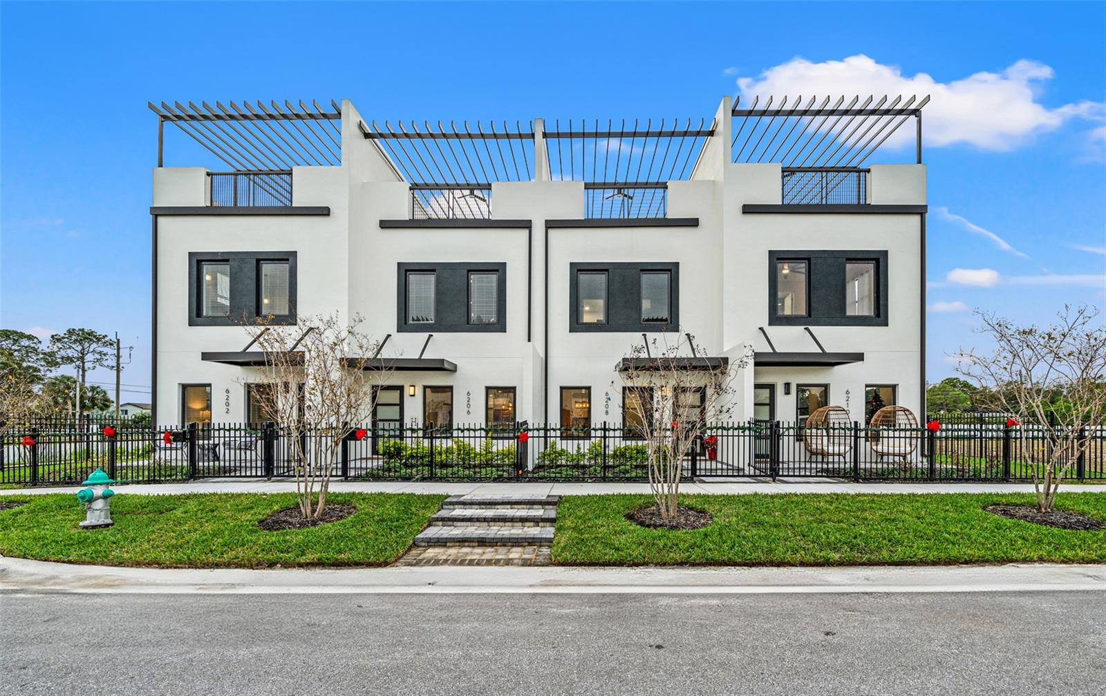 One or more photo(s) has been virtually staged. This house comes with a REDUCED RATE as low as 4.75% (APR 5.769%) as of 08/21/2025 through List & Lock. This is a seller paid rate-buydown that reduces the buyers interest rate and monthly payment. Terms apply, see disclosures for more information. Phase 3 OF CONSTRUCTION has started! This is our LAST interior unit available in phase one of construction! Exclusive builder incentives offered on this unit!!! Welcome to the brand new Latitudes in the Park, where luxury living reaches new heights in the heart of Pinellas Park. This exclusive gated community sits high and dry 21 feet above sea level ( say goodbye to flood insurance) l! THIS COMMUNITY QUALIFIES FOR 100% financing!!! We are glad to announce the community pool is COMPLETED! This community will feature 25 units when completed, This is the LAST interior unit in this phase of construction, additional builder incentives available for this unit!! These three-story residences, complete with massive rooftop terraces, embody contemporary living, showcasing an open floor plan seamlessly fusing kitchen, dining, and living spaces. The kitchen, a culinary haven, boasts quartz countertops, solid wood cabinets, and a large island, effortlessly blending style with functionality, distinguished by 10-foot ceiling heights. The primary bedroom is on the second floor and features a huge walk-in closet, an en-suite bathroom adorned with high-level finishes, including a generous walk-in shower and dual vanities. An additional bedroom is down the hall as well as an office or den that could easily be used as third bedroom. Ascend to the third floor, where the bonus loft leads to your rooftop terrace a haven with two sitting areas, water, and electric connections for a potential outdoor kitchen. Each townhome includes a 2 car garage and private driveway in the back. Embrace MAINTENANCE FREE living in this community where the community will pressure clean the buildings for you, water the lawn, mow the yards, maintain the landscaping and paint the buildings for you. You'll feel safe in this solid 3 story all concrete block construction, with ESW hurricane impact-rated windows and doors. To enhance the appeal, the builder extends a generous. For an additional bonus, this unit comes with complete with upgraded blinds, and closet built outs. There is still time to add even more upgrades if the buyer chooses. Latitudes in the Park immerses you in a thriving community. Pinellas Park is an emerging arts hub with galleries, the Pinellas Arts Village, monthly block parties, a local performing arts center, and an array of cafes, shops, and dining experiences. The neighborhood's friendly atmosphere, small businesses, green spaces, and beach community vibe offer exceptional value in the Tampa Bay area. Enjoy proximity to award-winning beaches, nature trails, museums, universities, and major airports. Nearby St. Petersburg and Tampa provide access to championship sports teams, concert venues, theme parks, and a diverse range of dining and shopping options. For an added plus Massey brewery has confirmed they are breaking ground right down the road, along with a new downtown area. For an added perk, every home owner will receive a 1 year gym membership to the brand new UFC gym, set to open July 2025. Are you ready to call Latitudes in the Park your new home?