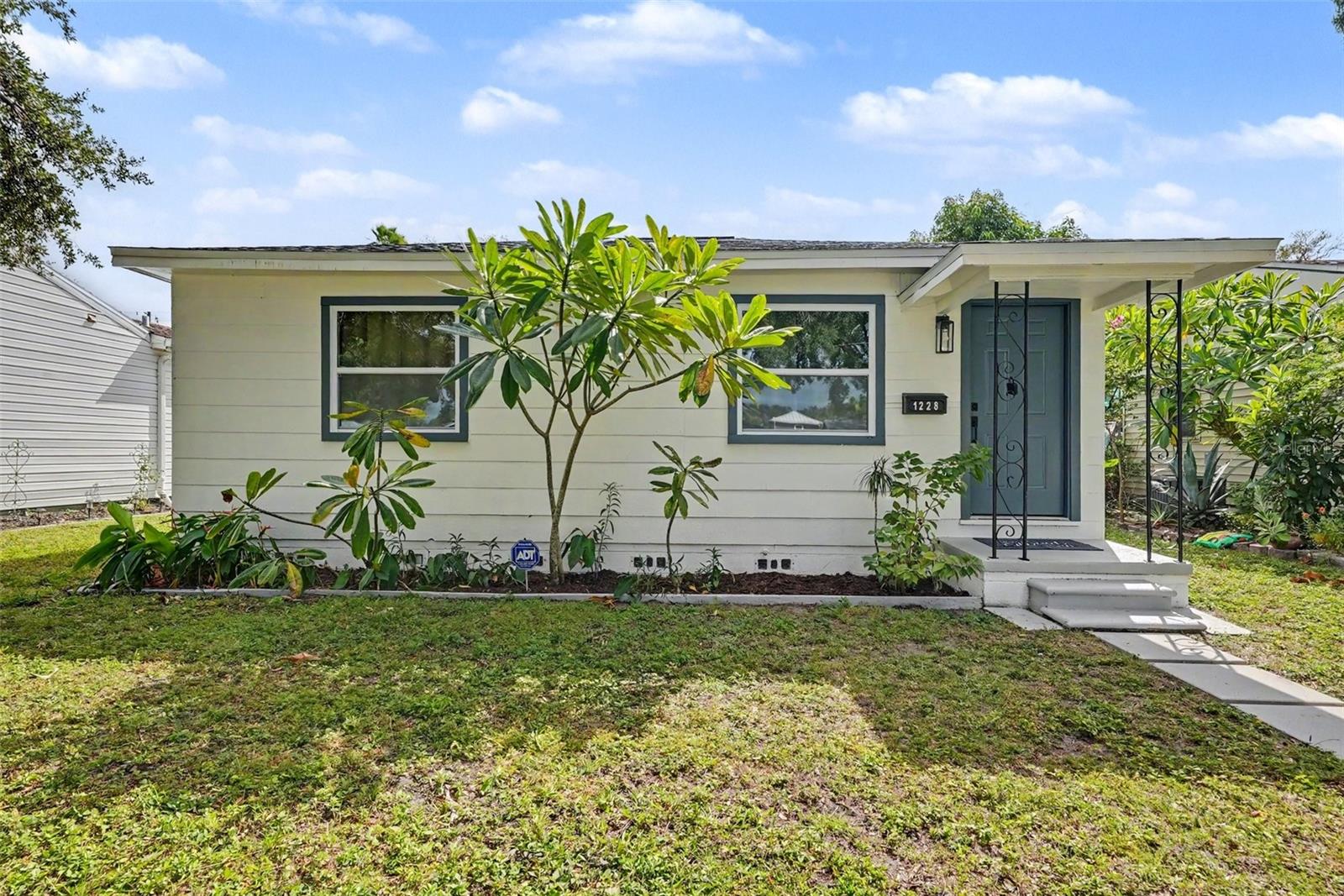 ST. PETERSBURG GEM–MOVE-IN READY! Welcome to 1228 56th Ave N, where modern upgrades, stylish finishes, and an unbeatable St. Petersburg location come together! This beautifully renovated 2-bedroom, 2-bathroom home offers the perfect blend of comfort, functionality, and Florida charm. Whether you're searching for your first home, a low-maintenance Florida retreat, or a smart investment opportunity, this property checks all the boxes! Step inside and fall in love with the upgrades. Enjoy peace of mind with a BRAND-NEW ROOF and BRAND-NEW CENTRAL HVAC SYSTEM, along with luxury vinyl plank flooring throughout. The stunning remodeled kitchen features elegant Carrara countertops, crisp white Shaker-style cabinetry, a stylish tile backsplash, and brand-new stainless steel appliances. Both bathrooms have been beautifully renovated with fresh, contemporary finishes, creating a clean and inviting atmosphere throughout the home. Situated on a cozy, fully fenced lot, this property offers plenty of private outdoor space for entertaining, weekend BBQs, pets, gardening, or simply enjoying the Florida sunshine. The convenient rear alley driveway provides additional accessibility and parking convenience. LOCATION, LOCATION, LOCATION! Ideally situated in the heart of St. Petersburg, just minutes from shopping, dining, schools, parks, and everyday conveniences, with easy access to vibrant Downtown St. Pete, its waterfront attractions, entertainment, and everything that makes the Tampa Bay lifestyle so desirable.