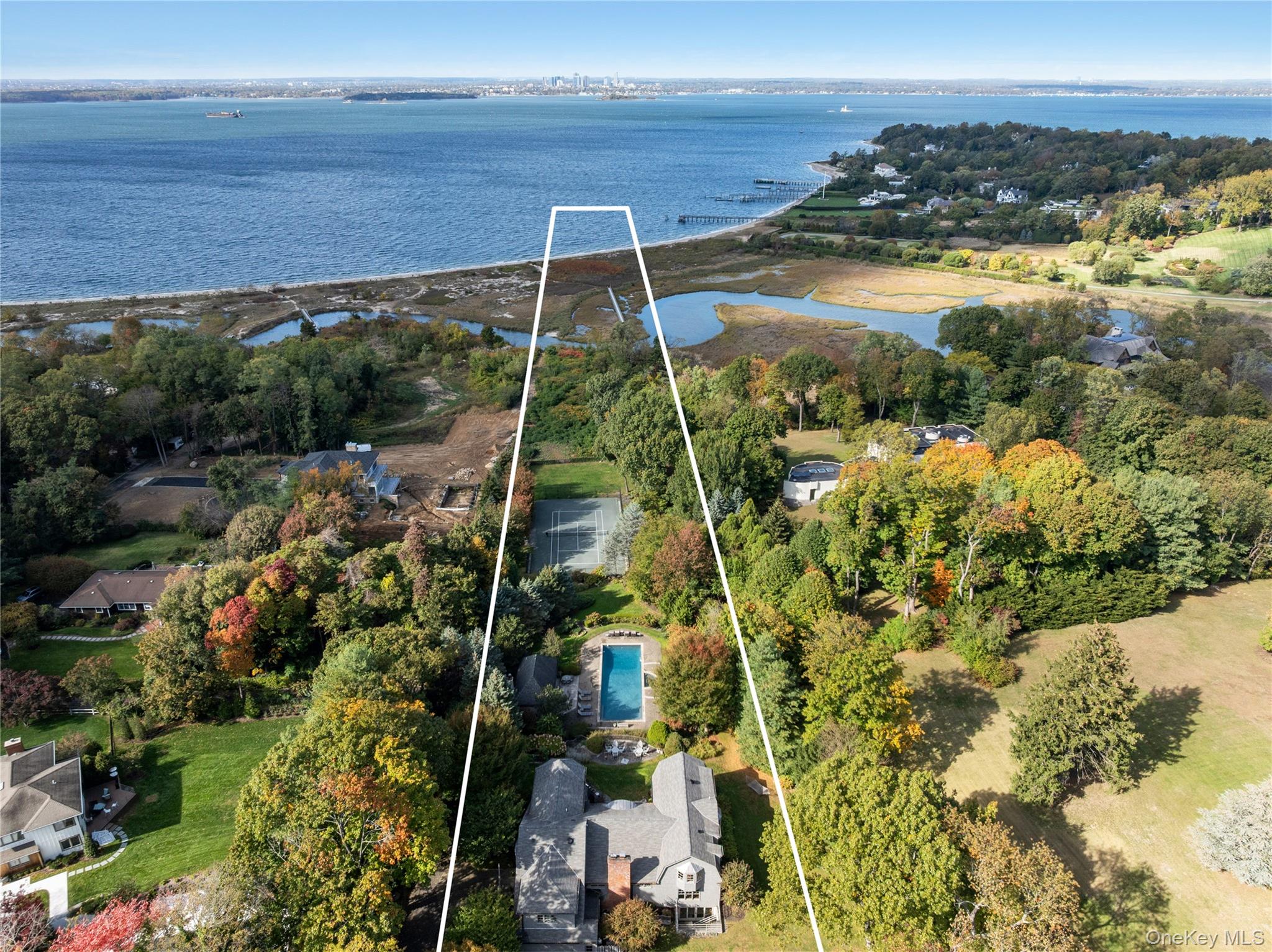 Set at the end of a secluded private drive, this stunning shingled Colonial estate sits gracefully atop a hill overlooking the Long Island Sound. Offering an unparalleled vantage point and exceptional privacy, this waterfront property unfolds as a true compound - complete with a Har-Tru tennis court, sparkling in-ground pool and spa, elegant pool house, main residence, and a detached garage with a fully appointed studio apartment.

Originally built in the 1950s, this designer home blends grand scale with timeless charm and warmth. Throughout, you’ll find wide-plank hardwood floors, river rock stone fireplace, and expansive windows that flood the interiors with natural light. A picturesque foyer opens to the gracious great room, designed for both living and dining, while the custom eat-in kitchen impresses with thick-cut marble countertops, chef-grade appliances, and a spacious walk-in pantry. Most formal living spaces offer captivating water views, and a series of French doors seamlessly connect the indoors to the home’s stunning outdoor entertaining areas.

The main level also includes a private office, large den, and two luxurious powder rooms. Upstairs, a mezzanine leads to the sun-drenched Primary Wing, featuring a generous bedroom with sitting area, two walk-in closets, and a spa-like bath with a sizable therapeutic shower and freestanding soaking tub. Four additional bedrooms complete the upper level - two with private en-suites and two connected by a Jack-and-Jill bath. The finished, walk-out lower level offers exceptional recreational space, including an art studio, media/theater room, game room, full bathroom, laundry room and a matted, glass-enclosed fitness area.

The grounds are nothing short of spectacular - a total of 4.5+ acres framed by mature landscaping, stone walls, and slate patios. Outdoor living is elevated with a built-in kitchen, expansive sundeck surrounding the pool, and a newly renovated pool house complete with a changing room, great hosting space, and kitchenette. A detached garage with a second floor apartment, adds flexibility for guests or staff. Additional features include two laundry rooms, a long circular stone driveway and dual garages providing a total of four parking spaces.

A curved stone terrace offers an elevated vantage point over the backyard amenities and shoreline. At the end of the property is a private wooden boardwalk that meanders through lush greenery and coastal vegetation, leading to your own sandy North Shore beach. This extraordinary home masterfully combines sophistication, comfort, and waterfront living at its finest.