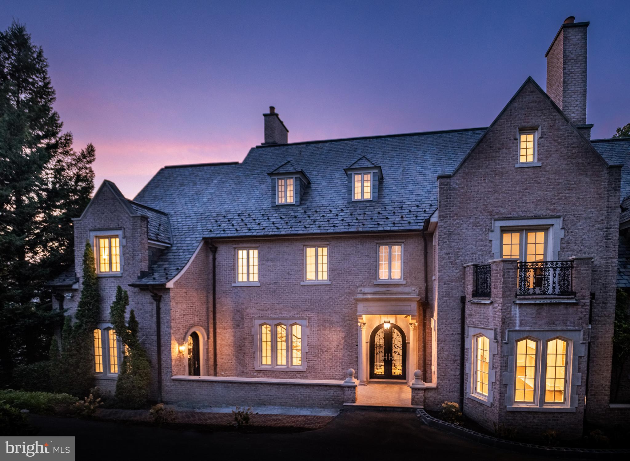 WHOLE HOUSE RENOVATION COMPLETED OVER THE LAST TWO YEARS.  POOL PLANS APPROVED - CONSTRUCTION TO BEGIN SHORTLY.  IN PROCESS OF STAGING WITH RENOWNED WASHINGTON DESIGNER ALLY BANKS.  Sited just 15 minutes from downtown Washington, but amongst the serene vistas of Battery Kemble Park, the trails of Glover Archbold Park, and five minutes from the heart of Georgetown, this eight-bedroom, nine full-bath and two-half-bath Tudor has undergone a custom, comprehensive renovation over the past two years.From the captivating foyer, where imported Italian black and white tiles meet soaring 12-foot ceilings, to the handcrafted casings around regal windows, archways, and doors, surprises await at every turn.The property offers both privacy for personal gatherings and the capability for large-scale entertaining.Its design incorporates both classic European features and modern amenities, including Waterworks fixtures, Visual Comfort lighting, a Lutron lighting system, an exterior video security system, five custom marble fireplaces, and six balconies throughout.An exquisite curved staircase and reception room allow owners and their guests to flow through elegant archways to refined living spaces. At the heart of the main level, a bespoke dual-sided fireplace acts as a focal point, connecting the formal living room to a distinguished parlor. This room boasts a luxurious hardwood, wrap-around wet bar, complemented by two full-sized Sub Zero wine refrigerators.The grandeur extends outdoors with four sets of French doors that open to a sprawling terrace and an expansive lawn, creating an idyllic setting for hosting grand events and countless guests.Orchestrate unforgettable evenings in the formal dining room, where a Cathedral ceiling, Herringbone floors, period windows, and custom shelving, add elegance and warmth.A butler’s pantry leads to a commercial-grade kitchen featuring custom Farrow and Ball painted cabinetry, a Lacanche range, a state-of-the-art dual SUBZERO refrigeration system, including a full-sized wine refrigerator, waterworks fixtures, and an expansive island topped with Calacatta marble. French doors open to a covered Veranda, where open-air dining and majestic views intertwine.Stay tuned for updates and additional photos as we complete these exciting improvements!