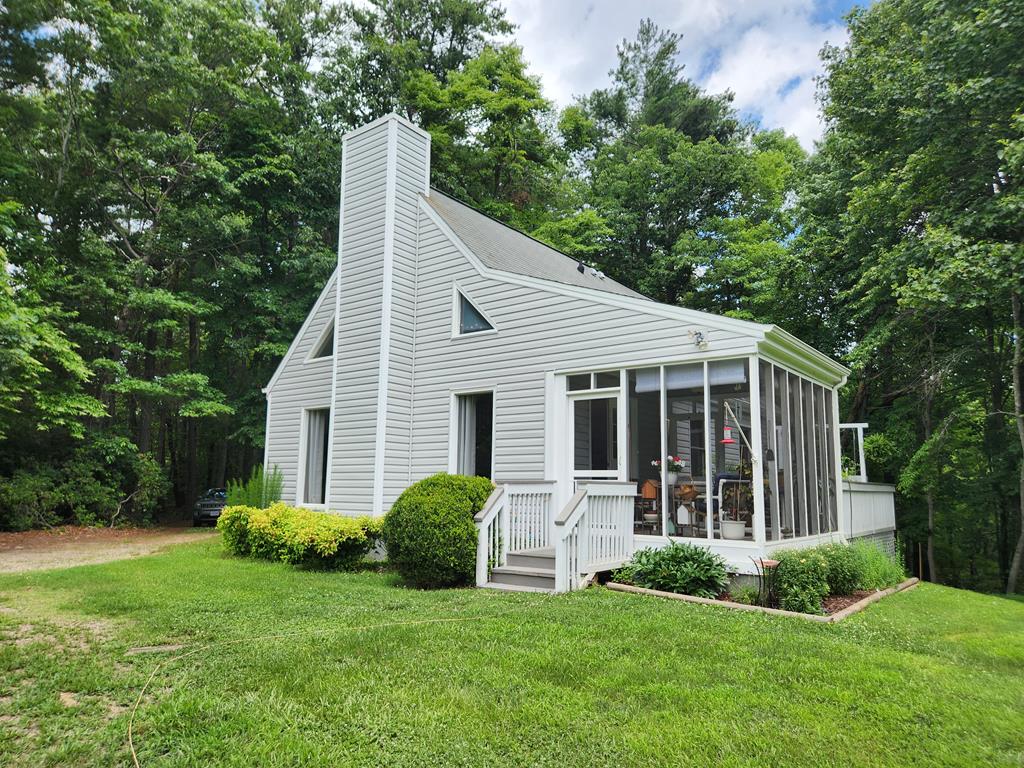 What a sweet cabin! Looking for a quiet retreat in the country? This 2 Bedroom 2 Bath cottage tucked in the woods is perfect. Open floor plan with cathedral ceiling in the great room. There is a soapstone stove for chilly nights and a screened porch for summer afternoons. The kitchen has plenty of cabinetry (recently stained) and a dining area. The home has had many upgrades including interior painting, new vinyl siding, vinyl wrapped windows, new hot water heater, stained decks and upgraded 30 & 50 amp camper electric outlets. A double carport for boat or car storage. Each bedroom has it's own small deck plus a large deck for grilling or hanging out. A workshop with electric and another smaller storage building. Located just 5 miles to Fairystone State Park and a short distance to Philpott Lake, the Blue Ridge Parkway and Floyd Virginia.