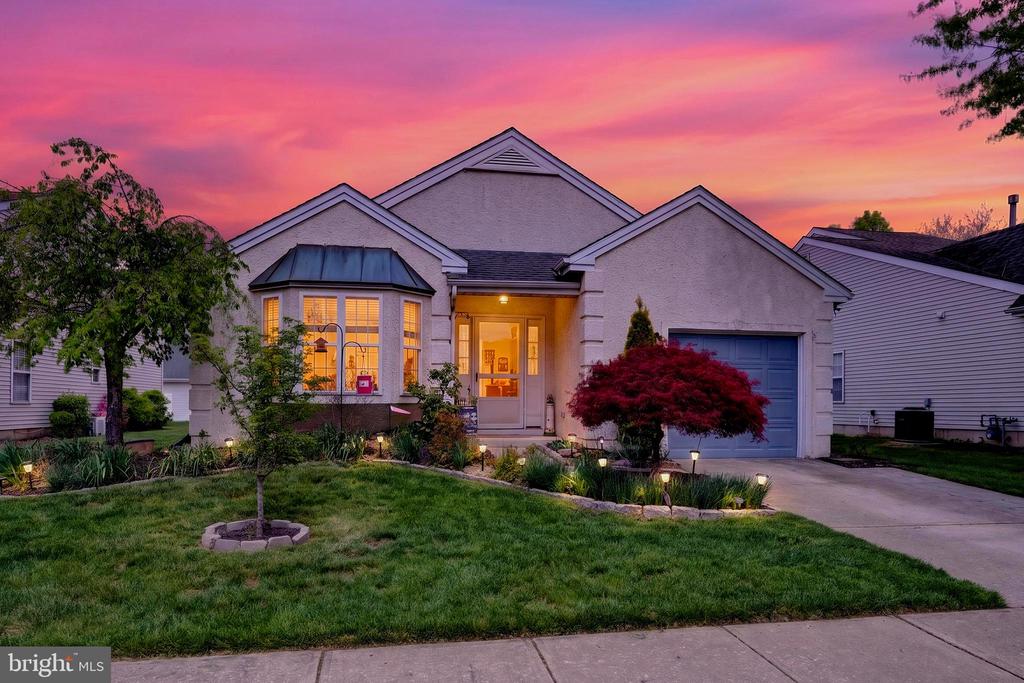 OPEN HOUSE SUN APR 26TH  3PM - 5PM  This move in ready Haverhill model, 1483 sq ft, in Holiday Village East, Mount Laurel’s sought-after 55+ community, features a thoughtfully remodeled, open-concept kitchen with Maple cabinetry providing an open layout into the dining room and living room and beautifully updated bathrooms. Plus major system updates include the roof (2014), Lennox Gas Heat and AC (2015), gas water heater (2016), an expanded driveway and expanded back patio 20 x 12 with fencing in 2021.From the moment you arrive, the beautifully landscaped exterior—highlighted by spring time daffodils—creates a welcoming first impression.Step into the foyer and into a bright, flowing layout where the kitchen has been thoughtfully remodeled and opened to the main living space—completely transforming how the home feels. A raised breakfast bar with granite countertops defines the space while maintaining open sightlines into the dining and living areas, ideal for both everyday living and entertaining. The kitchen features warm wood cabinetry with pantry closet, granite countertops, stainless steel appliances including a Samsung smooth-top electric range, Bosch dishwasher, and Whirlpool refrigerator, along with ceiling fan lights and a sun-filled bay window eating area.The formal living and dining rooms are spacious and inviting, enhanced by abundant natural light, recessed lighting, newer top-down/bottom-up blinds, and neutral carpeting that has been meticulously maintained.The rear den offers a comfortable retreat with luxury vinyl flooring, and glass French doors—perfect for added privacy while relaxing or watching TV.The primary suite includes two double closets, and a walk-in closet, plus a dressing area that has been thoughtfully separated with a sleek white barn door—creating added privacy and a more defined, functional space. The dressing area has a newer vanity with storage, and the bathroom has been remodeled with an updated vanity, toilet, showerhead, and newer flooring.The second bedroom is neutrally finished with newer blinds, while the full hall bathroom with a linen closet, has also been remodeled with a replacement vanity, toilet, showerhead, and tiled flooring.The laundry room includes a Maytag washer, Whirlpool dryer, and additional storage space.The garage has a bump-out for additional storage that houses the extra refrigerator/freezer included with the sale, and a dedicated utility closet for the heater and water heater for easy service access plus a pull down staircase to the attic.Out back, enjoy an expanded fenced in patio surrounded by mature landscaping—perfect for outdoor relaxation or entertaining. Residents of Holiday Village East enjoy a clubhouse offering a library, card room, craft room, game room, and exercise room, plus an outdoor pool open Memorial Day through Labor Day. The HOA provides lawn cutting, leaf removal, snow removal over two inches, maintenance of community grounds, tennis and pickleball courts, a half basketball court, and a wide variety of daily social activities and clubs. Conveniently located near shopping, restaurants, major highways, and award-winning medical facilities throughout Mount Laurel and Burlington County, this home offers comfortable, low-maintenance living in one of the area’s most popular 55+ communities. Come fall in love and make an offer today.  NOTE - Showings Are Limited To The Open Houses Only: Sun April 26th 3-5, Thurs April 30th 5-7, Sat May 2nd 11-2 and Sun May 3rd 1-4.   Offer Deadline of May 8th and Sellers Reserve The Right To Accept An Offer Before The Deadline.