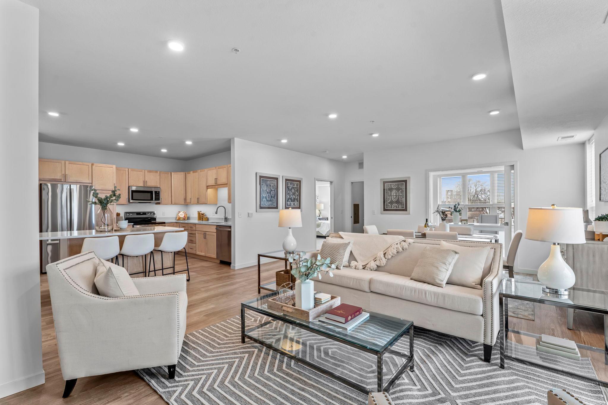 Welcome to Artessa Mound Harbor, a boutique 62+ co-op designed for those seeking an active lifestyle, stylish living, and a vibrant community. Overlooking Lost Lake Harbor on Lake Minnetonka, this stunning new community offers pride of ownership in a walkable location near shops, restaurants, lake life, and the Dakota Regional Trail. Artessa features just 52 residences, creating an intimate and connected atmosphere. This light-filled home offers an open-concept kitchen, dining, and living area with Andersen windows and 9’ ceilings. The kitchen features a large center island, quartz countertops, and stainless steel appliances. The layout includes two bedrooms plus a den, two spacious walk-in closets, a primary suite with a private 3/4 bath, and an additional full bathroom. Enjoy a maintenance-free screened-in deck, a large laundry room, and ample in-unit storage. One storage unit is included in the heated garage. Exceptional amenities include two private pickleball courts, outdoor terrace with grilling stations, fitness studio, game room, party room with serving kitchen, hobby makerspace, and boat slips on Lake Minnetonka exclusively for Artessa residents. Experience lakeside living at its finest. This unit includes a monthly membership fee of $2,757 which Includes Principal and interest toward fixed rate 40 year fully amortizing master mortgage, real estate taxes, property and liability insurance, operating expenses, operating and replacement reserves, interior and exterior maintenance, professional management, water, sewer trash/recycling, Cable TV, Internet, Climate controlled parking, shared amenities. Members only pay their own electricity, gas, and HO-6 insurance policy.