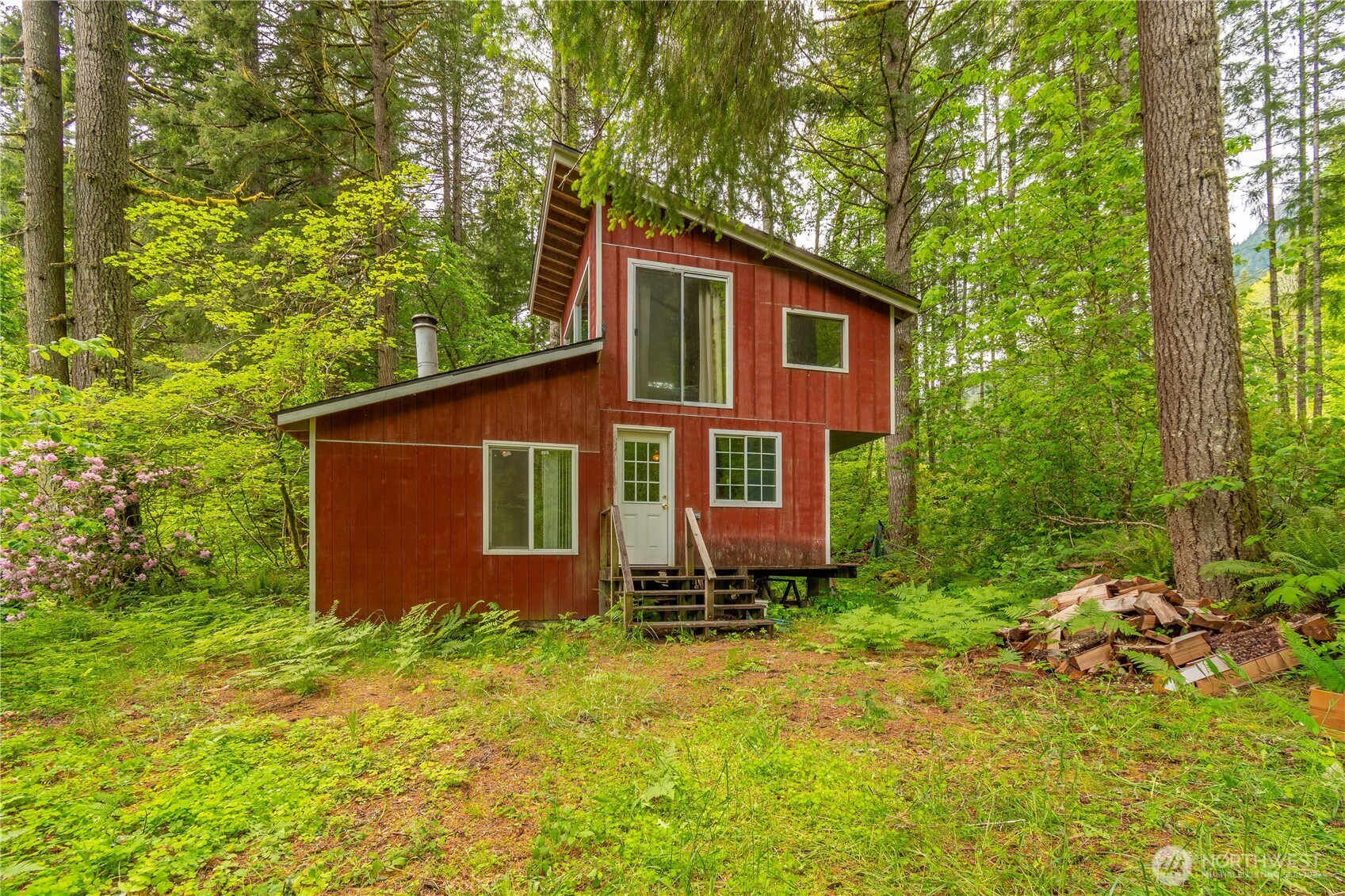 Recreational cabin 10 ACRES located near Randle, WA with White Pass, WA mailing address. Total of 640 SQ FT living space. Living room, Kitchen and eating area on main floor. Upstairs is large Bedroom. Owned Propane stove for cooking, Propane refrigerator and propane wired lighting. Free standing-The Earth Stove-for wood heating. Large windows for natural light. Rectangular 10 AC. Several other neighbors on same road use the gate. PUD power at corner of the property. Property is approximately 320 x 1320. Needs septic design and well if buyer wants to upgrade. This property is above the flood plain. 10 AC abuts National forest, up the hill. Cabin built 1992 by owner. Outhouse had tree fall on it, needs to be rebuilt.