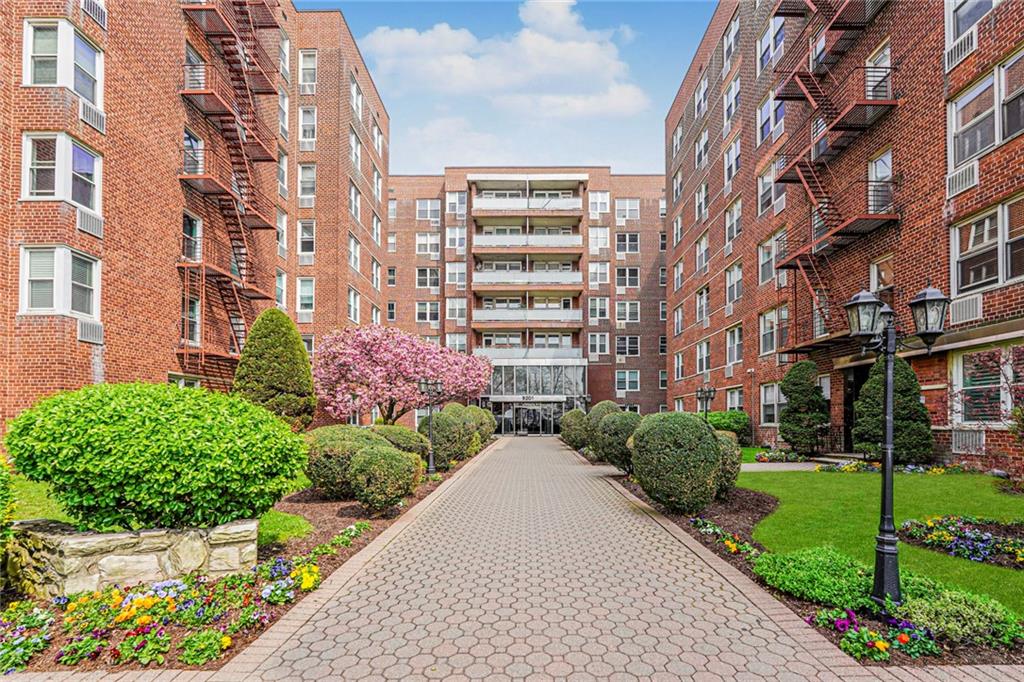Welcome to 9201 Shore Road, Unit C209 — a fully reimagined, turnkey residence offering elevated waterfront living in one of Bay Ridge’s most prestigious full-service buildings. This impeccably renovated home exudes modern sophistication, featuring richly refinished hardwood floors and elegant high-hat lighting throughout. Bathed in natural light, the expansive living and dining area offers a seamless blend of comfort and style—perfect for both intimate evenings and refined entertaining. The newly expanded designer kitchen is a true showpiece, appointed with sleek quartz countertops and a suite of stainless steel appliances, including a dishwasher, microwave, stove, refrigerator and beverage cooler—crafted for both beauty and functionality. Retreat to a generously proportioned king-sized bedroom complete with a space for custom walk-in closet, providing exceptional storage and a serene escape. The spa-inspired bathroom has been fully renovated with clean, contemporary finishes, offering a calming, luxurious ambiance. Residents enjoy white-glove amenities including a 24-hour doorman and concierge, live-in superintendent, on-site laundry, dedicated bike and storage areas, and an on-site parking garage (subject to availability). Perfectly positioned within the building, this residence offers a rare and coveted vantage point—overlooking lush manicured, botanical-style gardens with tranquil water views beyond. The result is a uniquely serene outlook that blends greenery and waterfront into a truly picturesque, almost resort-like setting. Set along the coveted Shore Road waterfront, this residence offers immediate access to the scenic promenade with breathtaking water views—an idyllic backdrop for morning or evening sunsets. Boutique shops, renowned dining destinations and transportation are a short distance away. Experience turnkey luxury by the water—Unit C209 is not to be missed.