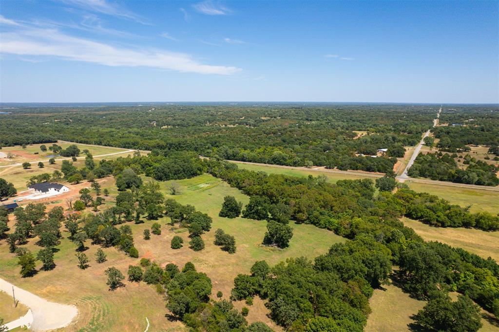 Rare opportunity to own 20 beautiful wooded acres offering privacy, natural beauty, and incredible flexibility for the future. This peaceful property is filled with mature trees and abundant wildlife, creating a private retreat where deer and other native wildlife are frequent visitors.One of the most unique features of this property is that it backs to protected conservation land where no future building is permitted, providing an exceptional buffer of natural surroundings and helping preserve the peaceful, secluded setting for years to come.The full 20 acres may be enjoyed as one private estate, or after purchase, the property offers the potential to be divided into two approximately 10-acre tracts, giving the new owner options for a future homesite, additional family property, investment, or resale.*Imagine building your dream home tucked among the trees, surrounded by nature with plenty of room for a shop, barn, recreational space, trails, or simply enjoying the privacy that acreage provides. Mornings can begin with wildlife wandering through the trees and evenings spent taking in the quiet surroundings away from the noise and congestion of city living.Properties offering this combination of acreage, mature trees, protected conservation land, wildlife, privacy, and future division potential are difficult to find. Whether you're searching for a secluded homesite, a family compound, recreational acreage, or land with long-term possibilities, these 20 acres offer an opportunity to create something truly special. This includes TWO 10 acre tracts Come walk the property and experience the peace, privacy, and possibilities for yourself.