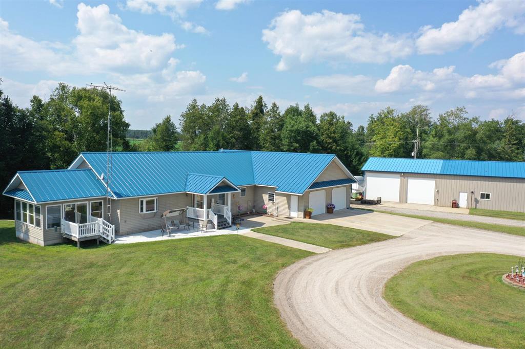 4 BEDROOM 3 BATH HOME ON 11.25 ACRES! Discover the perfect blend of space, comfort, and practicality in this expansive 4,316 sq. ft. home set on 11.25 scenic acres just minutes from West Branch and only 2.5 miles from Ogemaw Heights High School. Designed for both everyday living and entertaining, this property offers everything you need - and more. The main level offers 3 bedrooms and 2 full baths including a spacious master suite with a private ensuite bath and large walk-in closet. The bright, open living area features vaulted ceilings and a cozy stone fireplace. The large kitchen includes abundant oak cabinetry, a 6x10 walk-in pantry, and plenty of counter space for cooking or hosting. An attached 28x30 heated 2-car garage with in-floor radiant heat provides year-round comfort. The walk-out basement has approximately 1,700 finished sq. ft. of additional living space with a second full kitchen, additional bedroom, full bathroom, and laundry hookup in the bedroom's walk-in closet - perfect for guests, in-laws, or rental potential. It also offers direct access to the outdoors for easy entertaining or quiet relaxation. This home features a durable steel roof and in-floor radiant hot water heat throughout, plus a mini split heat pump for backup heating and cooling. It is also exceptionally well insulated, with closed cell foam in the walls and cellulose insulation in the ceiling for maximum energy efficiency and comfort. An impressive 2,700 sq. ft. outbuilding with in-floor heat, dedicated workshop, and loft storage adds even more value. The building includes two side garage doors (12' and 14') plus two end doors for exceptional versatility - ideal for RVs, boats, or equipment storage. Whether youre looking for a multigenerational living setup, a hobby farm, or a property with exceptional workspace, this home offers endless possibilities.
