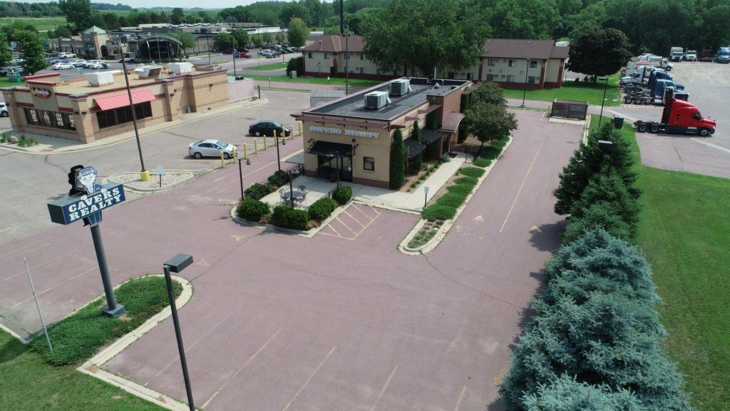 This is an amazing building with tons of windows allowing all kinds of natural light or you can use the professional blinds that have been installed.  It was originally built as a Starbucks and is now currently being used as a Real Estate company.  Could easily be a drive through restaurant as electrical and drive up widow are still there.  There is a front patio for outside seating.  Furniture in building to be sold separately.  Seller is a licensed Real Estate Broker in the state of Minnesota.