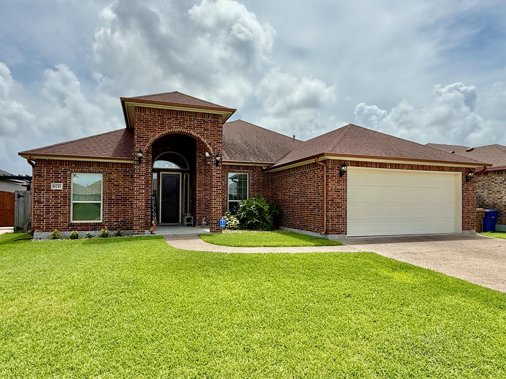 Just Reduced!! Welcome to 6717 Battery Park, an elegant all-brick home tucked away on a quiet cul-de-sac in beautiful Corpus Christi. This spacious property offers almost 2,300 square feet of thoughtfully designed living space, featuring 3 generously sized bedrooms and 2 full bathrooms. With a desirable open-concept layout and split-bedroom floor plan, this home provides both comfort and privacy for families or guests. As you enter, you'll notice the abundance of natural light and the tasteful combination of tile flooring in the main living areas and plush carpet in the bedrooms for added comfort. The light-filled primary suite serves as a relaxing retreat, complete with a luxurious en suite bathroom featuring a jetted tub, walk-in shower, and dual vanities. The two guest bedrooms are spacious and private, making them ideal for family, guests, or even a home office. This home offers both formal and casual dining options with a dedicated dining room and a cozy breakfast nook that overlooks the backyard. The kitchen is a chef's dream with an eating bar, central island, granite countertops, an abundance of solid wood cabinetry, and modern finishes. Perfect for entertaining or daily life, the open layout connects the kitchen seamlessly to the living areas. Additional upgrades include a surround sound system throughout the home, custom gutters, and a beautifully landscaped backyard with an inviting in-ground pool and a tranquil waterfall feature. A covered porch provides a shady retreat for outdoor relaxation or weekend BBQs. The three-car wide driveway adds convenience and curb appeal. Whether you're entertaining guests, raising a family, or looking for your forever home, 6717 Battery Park delivers comfort, quality, and an unbeatable location in a peaceful, private setting. Don't miss your opportunity to own this Corpus Christi gem!