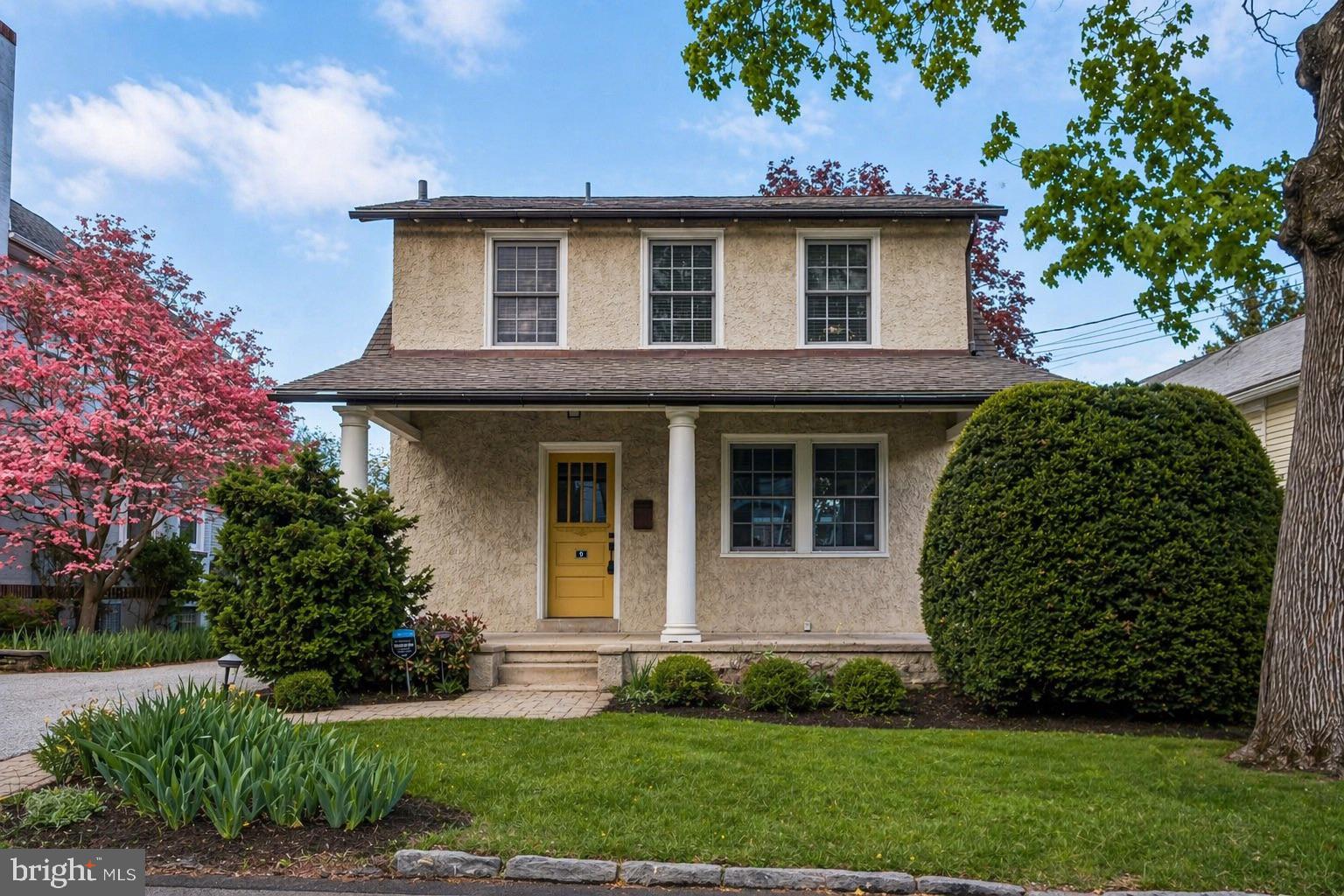 Welcome to 9 Doyle Road, a charming 1920’s craftsman-style home just steps from downtown Wayne in the Radnor School District. Set on a 4,800 SF lot, this property features an expansive backyard with terrace, outdoor fireplace, back deck, and a detached two-car garage with full driveway. A welcoming front porch opens to sun-filled living and dining areas with hardwood floors throughout. The modern kitchen includes white shaker cabinetry, subway tile backsplash, updated appliances, and a large pantry closet. Just off the kitchen is a powder room and mudroom providing easy access to the driveway and garage. A standout feature is the copper-clad conservatory, with french doors offering backyard views from both the dining room and finished basement. The finished basement adds flexible living space with second sink, custom cabinetry, laundry, and tons of storage. Upstairs on the second level are three well-sized bedrooms and a full bath. A perfect blend of character and convenience in the heart of Wayne - schedule your tour today.