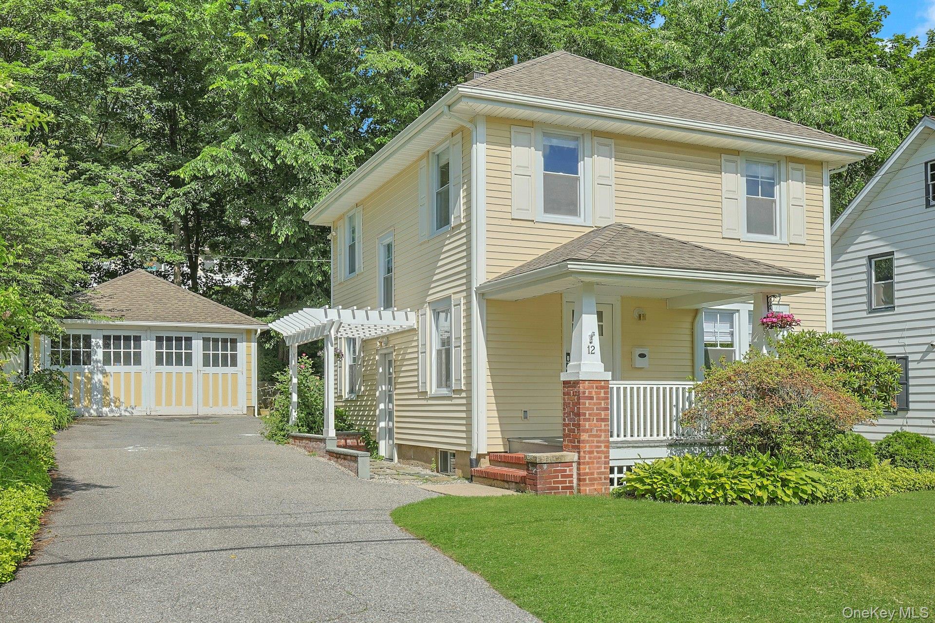 Welcome to 12 North Street, where the real luxury is the lifestyle. Nestled in the heart of Katonah, one of Westchester's most beloved communities, this charming 1929 Colonial offers the opportunity to leave your car at home and embrace true walkable living. Start your mornings with coffee from a neighborhood cafe, stroll to the Metro-North station for an easy commute to New York City, meet friends for dinner at one of Katonah's wonderful restaurants, browse the local shops, or spend weekends enjoying community events. Life in Katonah feels like something out of a Norman Rockwell painting. Tree-lined streets, locally owned businesses, the historic Katonah Reading Room, award-winning schools, and a welcoming sense of community make this one of the most desirable places to call home in Westchester. The main level interior features an open floorplan starting with a welcoming entryway, dining room, spacious living room, powder room and kitchen with a bay window overlooking the backyard. The second floor offers 3 bright bedrooms and an updated full bath, inclusive of a classic soaking tub and shower stall. The basement and detached two-car garage offer incredible flexibility for today's lifestyle. Whether you envision a home gym, artist's studio, workshop, hobby space, additional storage, or future finished space for a home office or creative retreat, these areas provide endless opportunities to tailor the property to your needs. Filled with natural light, the home features hardwood floors, classic French doors, and custom window treatments. Whether you're purchasing your first home, searching for the perfect downsizing opportunity, or simply looking for a home where charm and convenience come together, this home offers an exceptional opportunity to enjoy village living at its finest.