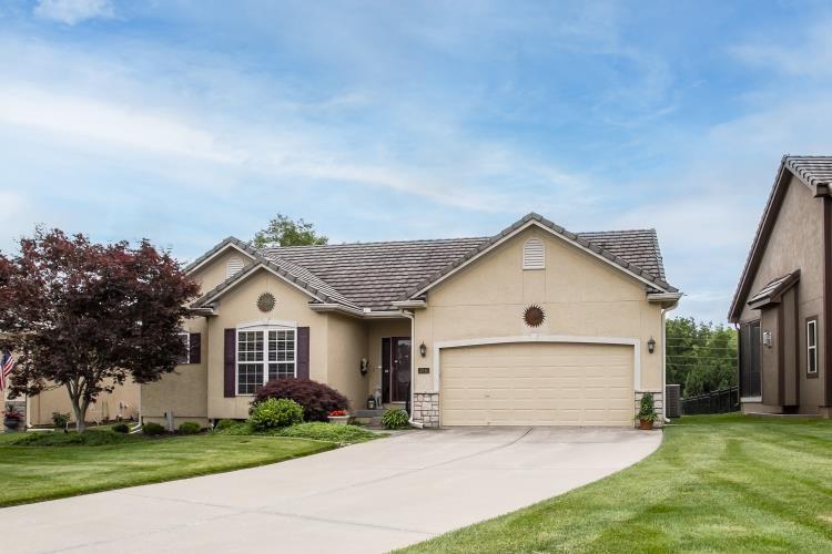 This Beautiful home has been well cared for. The Floorplan is open and inviting with a large hallway that leads into the Great room and kitchen, offering a huge island, gorgeous cabinetry and a very large pantry. Cabinets offer over and under lighting for setting a relaxing mood. Two large bedrooms are on the main floor with an additional hall bath as well as a main floor laundry offering a built in pocket office. Downstairs you will find a large rec room area, wet bar and one additional bedroom and bath. This home gives you a huge storage room and large closets in every bedroom so you can store your head off!  The Clubhouse Cottages is a great neighborhood of maintenance provided homes where you can simply lock and leave. Lawn maintenance and snow removal are provided along with all the other wonderful amenities of Lakewood!