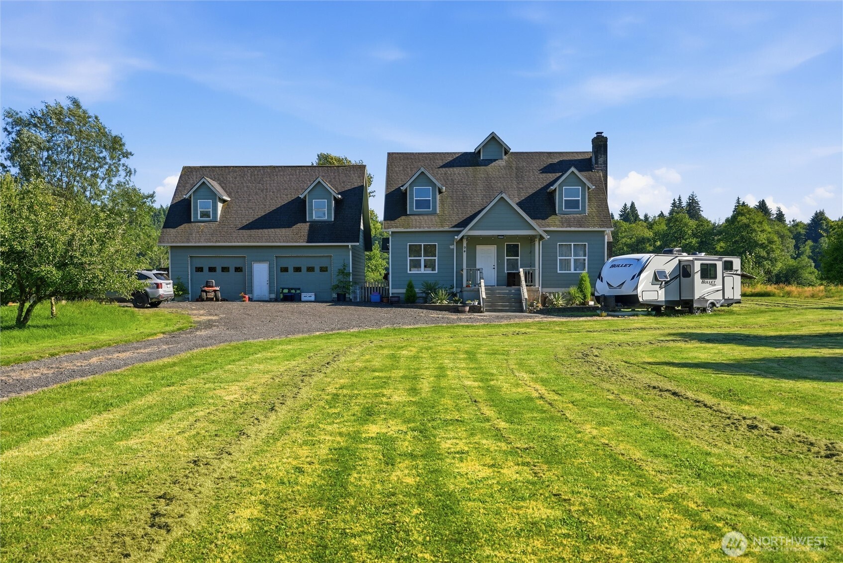 Tucked away in the peaceful Grays River Valley, this beautifully updated 5-bedroom, 3.5-bath home offers 3,744 SF of thoughtfully updated living space on 1.78 private acres. From the remodeled kitchen to the refreshed interior and exterior, nearly every inch has been improved, creating a move-in-ready retreat surrounded by nature. The spacious floor plan features multiple living areas, an office, laundry on the main level, two primary's(one on each level) offering multigenerational living, making it easy to accommodate long-term guests. Upstairs, escape to the private primary retreat featuring a spacious ensuite, and its own secluded deck overlooking the surrounding landscape—the perfect place to enjoy your morning coffee or unwind at the end of the day. Outside, enjoy a covered patio, expansive deck, over 20 fruit trees, RV and boat parking, and a large detached garage/shop with a loft offering endless possibilities for storage, a workshop, or recreation. Whether you're looking for a peaceful primary residence, a weekend getaway, or an incredible opportunity for a vacation home or short-term rental, this one-of-a-kind property offers the privacy, space, and setting to make it all possible. Come experience everything this remarkable property has to offer—schedule your private tour today before this rare opportunity is gone! Priced to sell!